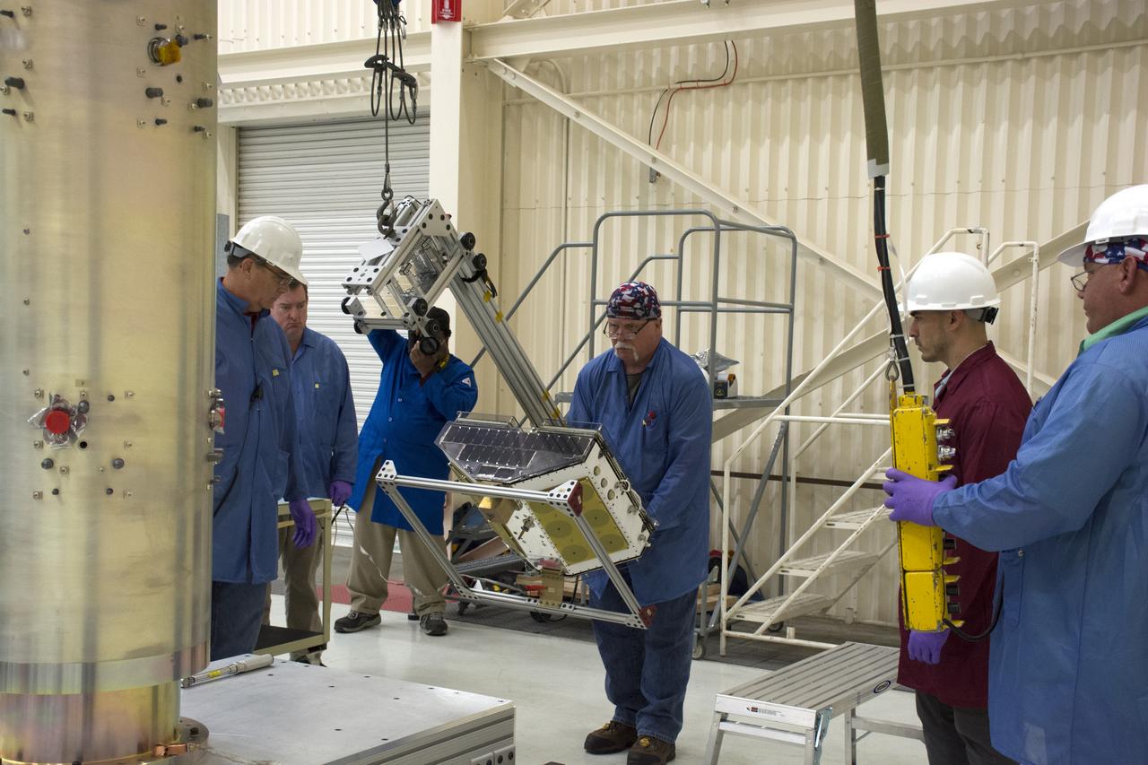 Inside Building 1555 at Vandenberg Air Force Base in California, technicians and engineers install one of eight NASA Cyclone Global Navigation Satellite System (CYGNSS) spacecraft on its deployment module. Processing activities will prepare the spacecraft for launch aboard an Orbital ATK Pegasus XL rocket. When preparations are competed at Vandenberg, the rocket will be transported to NASA’s Kennedy Space Center in Florida attached to the Orbital ATK L-1011 carrier aircraft with in its payload fairing. CYGNSS will launch on the Pegasus XL rocket from the Skid Strip at Cape Canaveral Air Force Station. CYGNSS will make frequent and accurate measurements of ocean surface winds throughout the life cycle of tropical storms and hurricanes. The data that CYGNSS provides will enable scientists to probe key air-sea interaction processes that take place near the core of storms, which are rapidly changing and play a critical role in the beginning and intensification of hurricanes.