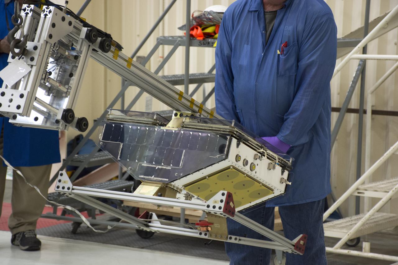Inside Building 1555 at Vandenberg Air Force Base in California, technicians and engineers install one of eight NASA Cyclone Global Navigation Satellite System (CYGNSS) spacecraft on its deployment module. Processing activities will prepare the spacecraft for launch aboard an Orbital ATK Pegasus XL rocket. When preparations are competed at Vandenberg, the rocket will be transported to NASA’s Kennedy Space Center in Florida attached to the Orbital ATK L-1011 carrier aircraft with in its payload fairing. CYGNSS will launch on the Pegasus XL rocket from the Skid Strip at Cape Canaveral Air Force Station. CYGNSS will make frequent and accurate measurements of ocean surface winds throughout the life cycle of tropical storms and hurricanes. The data that CYGNSS provides will enable scientists to probe key air-sea interaction processes that take place near the core of storms, which are rapidly changing and play a critical role in the beginning and intensification of hurricanes.
