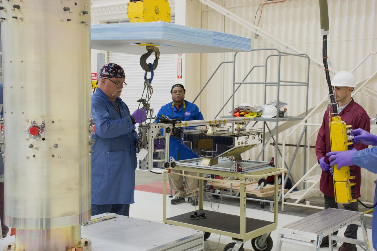 Inside Building 1555 at Vandenberg Air Force Base in California, technicians and engineers install one of eight NASA Cyclone Global Navigation Satellite System (CYGNSS) spacecraft on its deployment module. Processing activities will prepare the spacecraft for launch aboard an Orbital ATK Pegasus XL rocket. When preparations are competed at Vandenberg, the rocket will be transported to NASA’s Kennedy Space Center in Florida attached to the Orbital ATK L-1011 carrier aircraft with in its payload fairing. CYGNSS will launch on the Pegasus XL rocket from the Skid Strip at Cape Canaveral Air Force Station. CYGNSS will make frequent and accurate measurements of ocean surface winds throughout the life cycle of tropical storms and hurricanes. The data that CYGNSS provides will enable scientists to probe key air-sea interaction processes that take place near the core of storms, which are rapidly changing and play a critical role in the beginning and intensification of hurricanes.