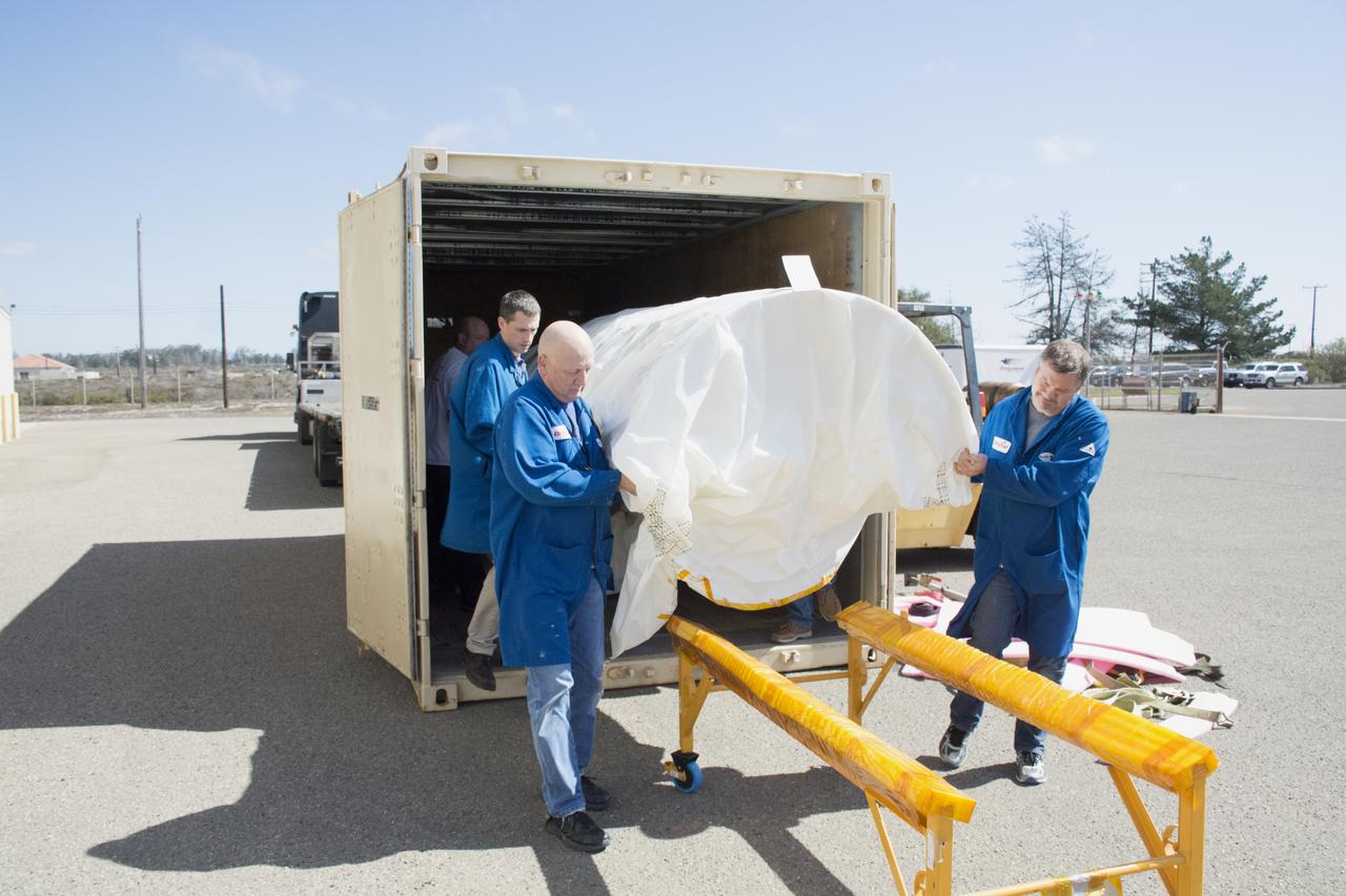 Technicians with Orbital ATK remove the first half of the Pegasus payload fairing for NASA’s Cyclone Global Navigation Satellite System (CYGNSS) from its shipping container near Building 1555 at Vandenberg Air Force Base in California. CYGNSS is being prepared at Vandenberg, and then will be transported to NASA’s Kennedy Space Center in Florida aboard the Orbital ATK Pegasus XL rocket which will be attached to the Orbital ATK L-1011 carrier aircraft. CYGNSS will launch on the Pegasus XL rocket from the Skid Strip at Cape Canaveral Air Force Station. CYGNSS will make frequent and accurate measurements of ocean surface winds throughout the life cycle of tropical storms and hurricanes. The data that CYGNSS provides will enable scientists to probe key air-sea interaction processes that take place near the core of storms, which are rapidly changing and play a critical role in the beginning and intensification of hurricanes.