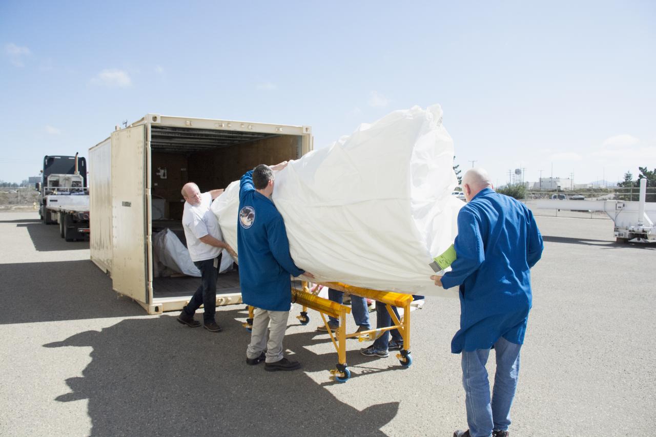 Technicians with Orbital ATK remove the first half of the Pegasus payload fairing for NASA’s Cyclone Global Navigation Satellite System (CYGNSS) from its shipping container near Building 1555 at Vandenberg Air Force Base in California. CYGNSS is being prepared at Vandenberg, and then will be transported to NASA’s Kennedy Space Center in Florida aboard the Orbital ATK Pegasus XL rocket which will be attached to the Orbital ATK L-1011 carrier aircraft. CYGNSS will launch on the Pegasus XL rocket from the Skid Strip at Cape Canaveral Air Force Station. CYGNSS will make frequent and accurate measurements of ocean surface winds throughout the life cycle of tropical storms and hurricanes. The data that CYGNSS provides will enable scientists to probe key air-sea interaction processes that take place near the core of storms, which are rapidly changing and play a critical role in the beginning and intensification of hurricanes. 