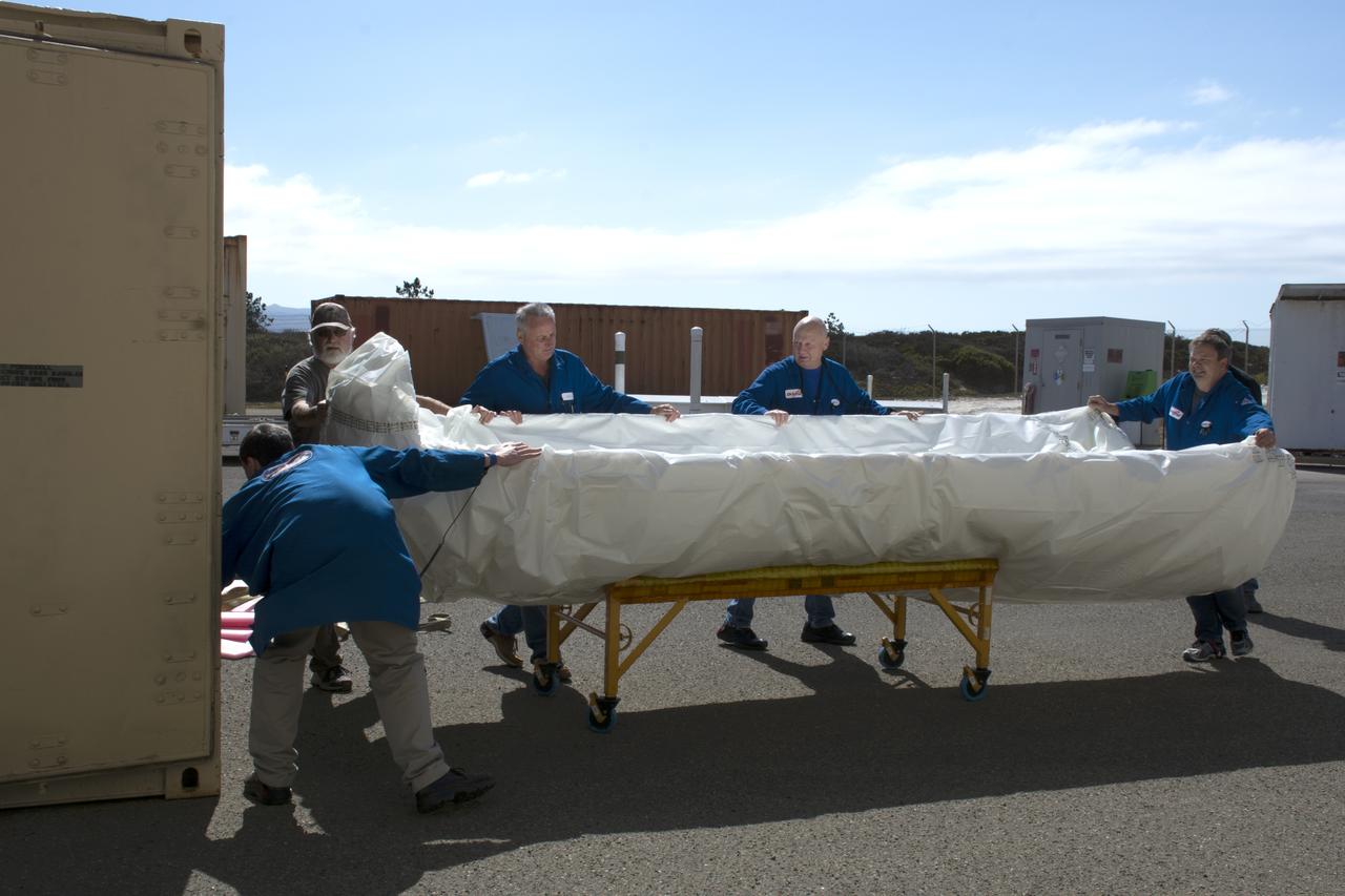 Technicians with Orbital ATK remove the first half of the Pegasus payload fairing for NASA’s Cyclone Global Navigation Satellite System (CYGNSS) from its shipping container and prepare it for the move to nearby Building 1555 at Vandenberg Air Force Base in California. CYGNSS is being prepared at Vandenberg, and then will be transported to NASA’s Kennedy Space Center in Florida aboard the Orbital ATK Pegasus XL rocket which will be attached to the Orbital ATK L-1011 carrier aircraft. CYGNSS will launch on the Pegasus XL rocket from the Skid Strip at Cape Canaveral Air Force Station. CYGNSS will make frequent and accurate measurements of ocean surface winds throughout the life cycle of tropical storms and hurricanes. The data that CYGNSS provides will enable scientists to probe key air-sea interaction processes that take place near the core of storms, which are rapidly changing and play a critical role in the beginning and intensification of hurricanes.