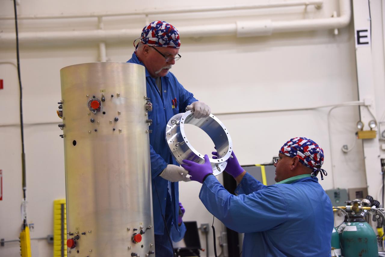 Technicians with Orbital ATK check assemble the micro satellites deployment module for NASA’s Cyclone Global Navigation Satellite System (CYGNSS) in Building 1555 at Vandenberg Air Force Base in California. CYGNSS is being prepared at Vandenberg, and then will be transported to NASA’s Kennedy Space Center in Florida aboard the Orbital ATK Pegasus XL rocket which will be attached to the Orbital ATK L-1011 carrier aircraft. CYGNSS will launch on the Pegasus XL rocket from the Skid Strip at Cape Canaveral Air Force Station. CYGNSS will make frequent and accurate measurements of ocean surface winds throughout the life cycle of tropical storms and hurricanes. The data that CYGNSS provides will enable scientists to probe key air-sea interaction processes that take place near the core of storms, which are rapidly changing and play a critical role in the beginning and intensification of hurricanes.