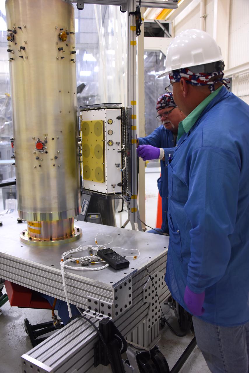 Technicians with Orbital ATK install the first set of micro satellites on the deployment module for NASA’s Cyclone Global Navigation Satellite System (CYGNSS) in Building 1555 at Vandenberg Air Force Base in California. CYGNSS is being prepared at Vandenberg, and then will be transported to NASA’s Kennedy Space Center in Florida aboard the Orbital ATK Pegasus XL rocket which will be attached to the Orbital ATK L-1011 carrier aircraft. CYGNSS will launch on the Pegasus XL rocket from the Skid Strip at Cape Canaveral Air Force Station. CYGNSS will make frequent and accurate measurements of ocean surface winds throughout the life cycle of tropical storms and hurricanes. The data that CYGNSS provides will enable scientists to probe key air-sea interaction processes that take place near the core of storms, which are rapidly changing and play a critical role in the beginning and intensification of hurricanes. 