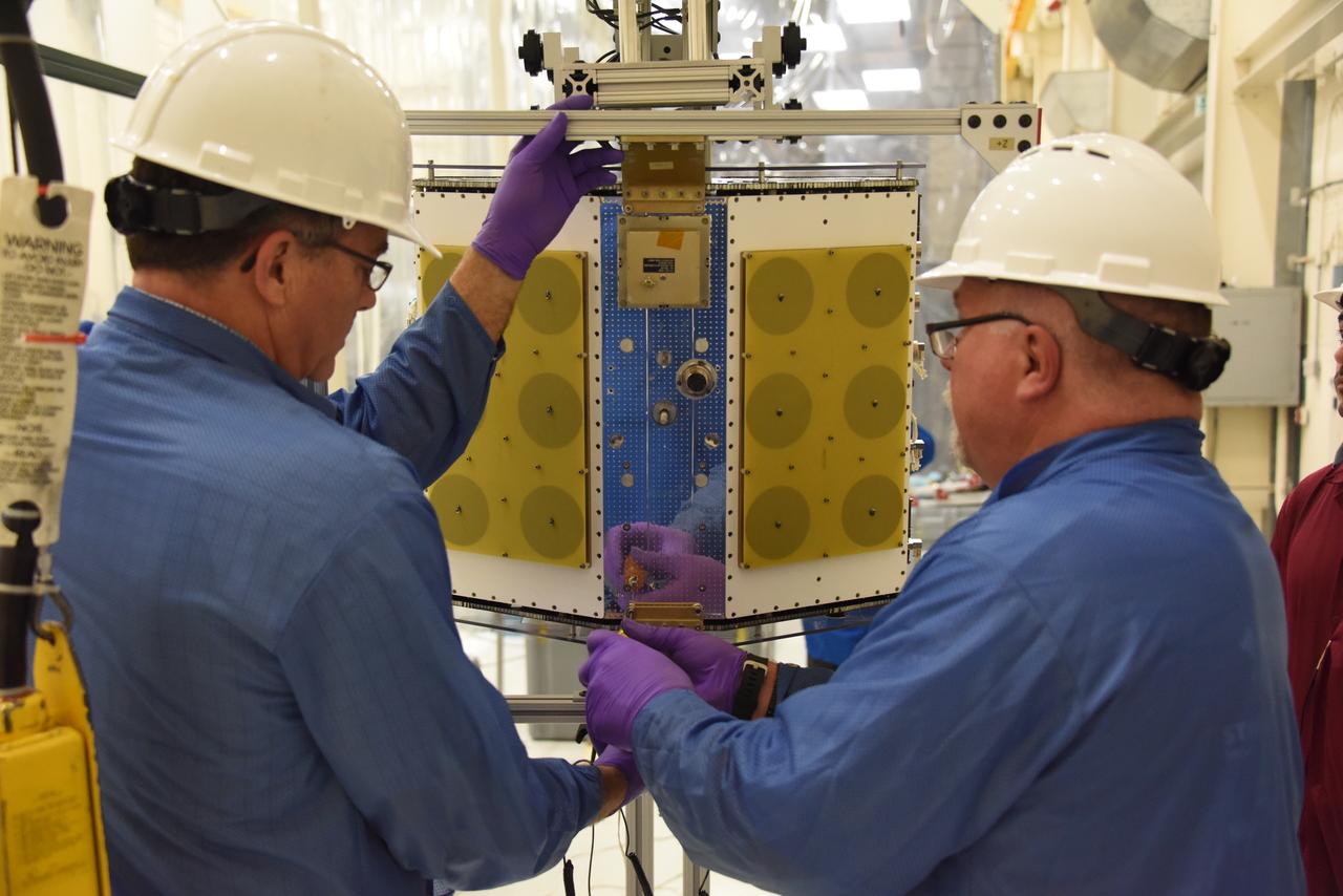 Technicians with Orbital ATK continue to install micro satellites on the deployment module for NASA’s Cyclone Global Navigation Satellite System (CYGNSS) in Building 1555 at Vandenberg Air Force Base in California. CYGNSS is being prepared at Vandenberg, and then will be transported to NASA’s Kennedy Space Center in Florida aboard the Orbital ATK Pegasus XL rocket which will be attached to the Orbital ATK L-1011 carrier aircraft. CYGNSS will launch on the Pegasus XL rocket from the Skid Strip at Cape Canaveral Air Force Station. CYGNSS will make frequent and accurate measurements of ocean surface winds throughout the life cycle of tropical storms and hurricanes. The data that CYGNSS provides will enable scientists to probe key air-sea interaction processes that take place near the core of storms, which are rapidly changing and play a critical role in the beginning and intensification of hurricanes. 
