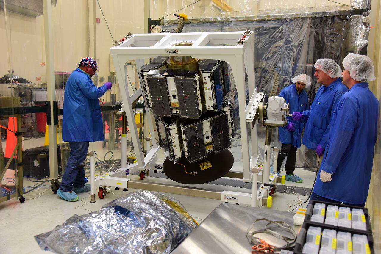 Inside Building 1555 at Vandenberg Air Force Base in California, the eight NASA Cyclone Global Navigation Satellite System (CYGNSS) spacecraft installed on their deployment module undergo inspections prior to NASA’s Kennedy Space Center in Florida. Processing activities will prepare the spacecraft for launch aboard an Orbital ATK Pegasus XL rocket. When preparations are competed at Vandenberg, the rocket will be transported to Kennedy attached to the Orbital ATK L-1011 carrier aircraft with in its payload fairing. CYGNSS will launch on the Pegasus XL rocket from the Skid Strip at Cape Canaveral Air Force Station. CYGNSS will make frequent and accurate measurements of ocean surface winds throughout the life cycle of tropical storms and hurricanes. The data that CYGNSS provides will enable scientists to probe key air-sea interaction processes that take place near the core of storms, which are rapidly changing and play a critical role in the beginning and intensification of hurricanes.