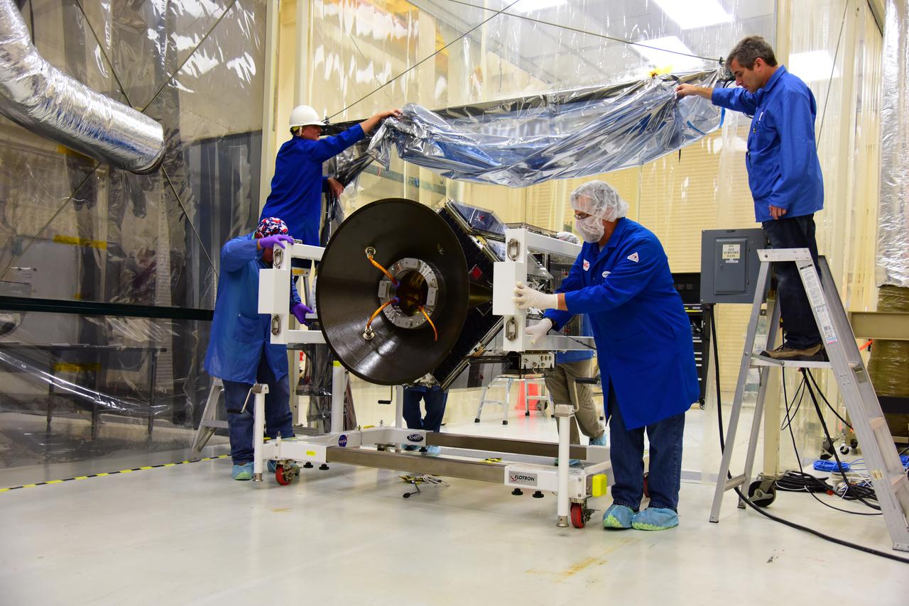 Inside Building 1555 at Vandenberg Air Force Base in California, the eight NASA Cyclone Global Navigation Satellite System (CYGNSS) spacecraft installed on their deployment module undergo inspections prior to NASA’s Kennedy Space Center in Florida. Processing activities will prepare the spacecraft for launch aboard an Orbital ATK Pegasus XL rocket. When preparations are competed at Vandenberg, the rocket will be transported to Kennedy attached to the Orbital ATK L-1011 carrier aircraft with in its payload fairing. CYGNSS will launch on the Pegasus XL rocket from the Skid Strip at Cape Canaveral Air Force Station. CYGNSS will make frequent and accurate measurements of ocean surface winds throughout the life cycle of tropical storms and hurricanes. The data that CYGNSS provides will enable scientists to probe key air-sea interaction processes that take place near the core of storms, which are rapidly changing and play a critical role in the beginning and intensification of hurricanes.