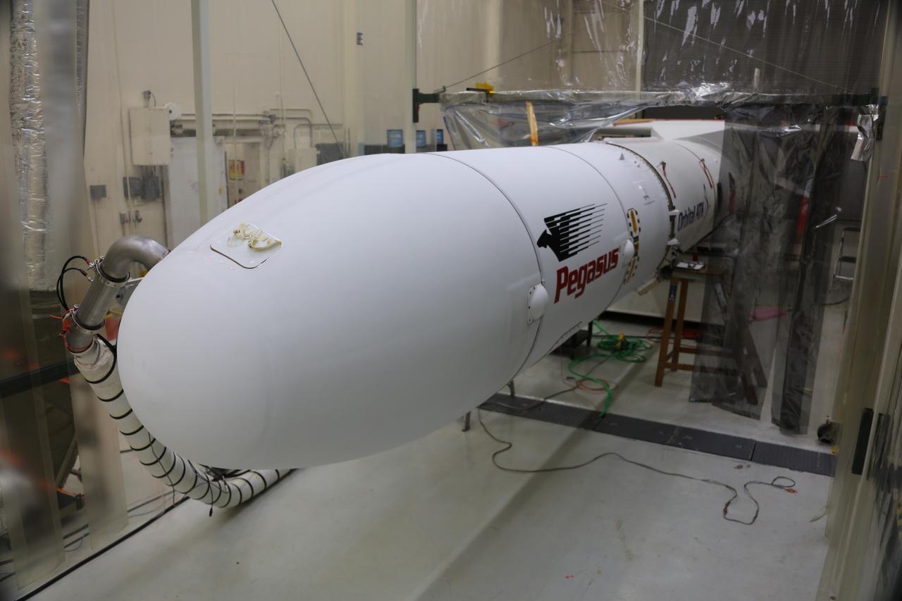 In Building 1555 at Vandenberg Air Force Base in California, an Orbital ATK Pegasus XL rocket is seen after payload fairing installation. On board Pegasus are eight NASA Cyclone Global Navigation Satellite System, or CYGNSS, spacecraft. When preparations are competed at Vandenberg, the L-1011/Pegasus XL combination will be flown to NASA’s Kennedy Space Center in Florida. On Dec. 12, 2016, the carrier aircraft is scheduled to take off from the Skid Strip at Cape Canaveral Air Force Station and CYGNSS will launch on the Pegasus XL rocket with the L-1011 flying off shore. CYGNSS satellites will make frequent and accurate measurements of ocean surface winds throughout the life cycle of tropical storms and hurricanes. The data that CYGNSS provides will help scientists to probe key air-sea interaction processes that take place near the core of storms, which are rapidly changing and play a crucial role in the beginning and intensification of hurricanes.