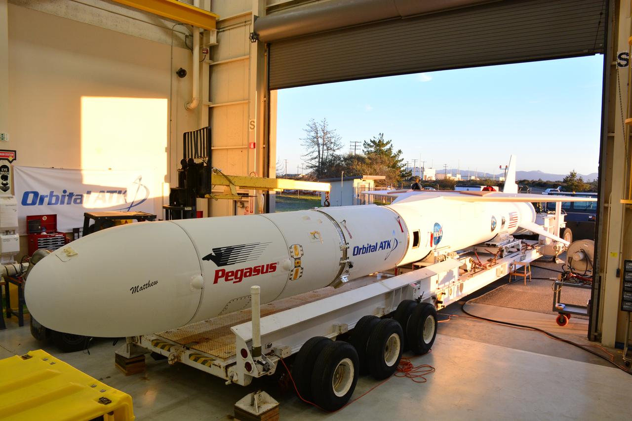 At Vandenberg Air Force Base in California, an Orbital ATK Pegasus XL rocket is placed on an assembly integration transporter for the move from the hangar at Building 1555 to be mated to L-1011 carrier aircraft near Vandenberg's runway. On board Pegasus are eight NASA Cyclone Global Navigation Satellite System, or CYGNSS, spacecraft. When preparations are competed at Vandenberg, the L-1011/Pegasus XL combination will be flown to NASA’s Kennedy Space Center in Florida. On Dec. 12, 2016, the carrier aircraft is scheduled to take off from the Skid Strip at Cape Canaveral Air Force Station and CYGNSS will launch on the Pegasus XL rocket with the L-1011 flying off shore. CYGNSS satellites will make frequent and accurate measurements of ocean surface winds throughout the life cycle of tropical storms and hurricanes. The data that CYGNSS provides will enable scientists to probe key air-sea interaction processes that take place near the core of storms, which are rapidly changing and play a critical role in the beginning and intensification of hurricanes.