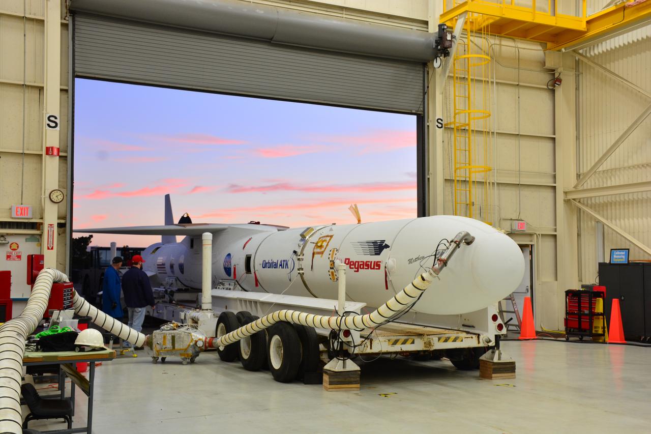 At Vandenberg Air Force Base in California, an Orbital ATK Pegasus XL rocket is placed on an assembly integration transporter for the move from the hangar at Building 1555 to be mated to L-1011 carrier aircraft near Vandenberg's runway. On board Pegasus are eight NASA Cyclone Global Navigation Satellite System, or CYGNSS, spacecraft. When preparations are competed at Vandenberg, the L-1011/Pegasus XL combination will be flown to NASA’s Kennedy Space Center in Florida. On Dec. 12, 2016, the carrier aircraft is scheduled to take off from the Skid Strip at Cape Canaveral Air Force Station and CYGNSS will launch on the Pegasus XL rocket with the L-1011 flying off shore. CYGNSS satellites will make frequent and accurate measurements of ocean surface winds throughout the life cycle of tropical storms and hurricanes. The data that CYGNSS provides will enable scientists to probe key air-sea interaction processes that take place near the core of storms, which are rapidly changing and play a critical role in the beginning and intensification of hurricanes.