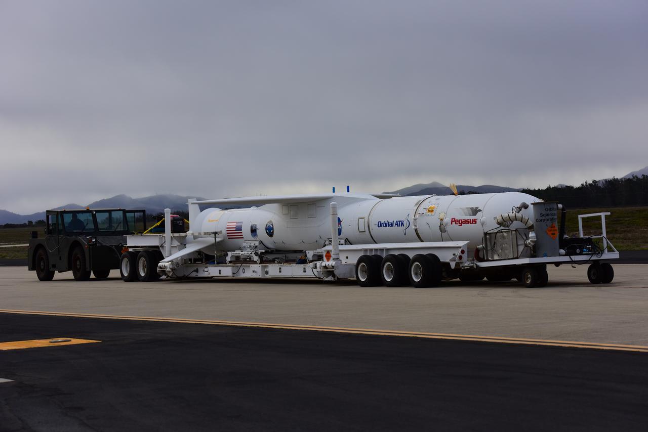 At Vandenberg Air Force Base in California, an Orbital ATK Pegasus XL rocket is transported to be mated to the company's L-1011 carrier aircraft near Vandenberg's runway. On board Pegasus are eight NASA Cyclone Global Navigation Satellite System, or CYGNSS, spacecraft. When preparations are competed at Vandenberg, the L-1011/Pegasus XL combination will be flown to NASA’s Kennedy Space Center in Florida. On Dec. 12, 2016, the carrier aircraft is scheduled to take off from the Skid Strip at Cape Canaveral Air Force Station and CYGNSS will launch on the Pegasus XL rocket with the L-1011 flying off shore. CYGNSS satellites will make frequent and accurate measurements of ocean surface winds throughout the life cycle of tropical storms and hurricanes. The data that CYGNSS provides will enable scientists to probe key air-sea interaction processes that take place near the core of storms, which are rapidly changing and play a critical role in the beginning and intensification of hurricanes.