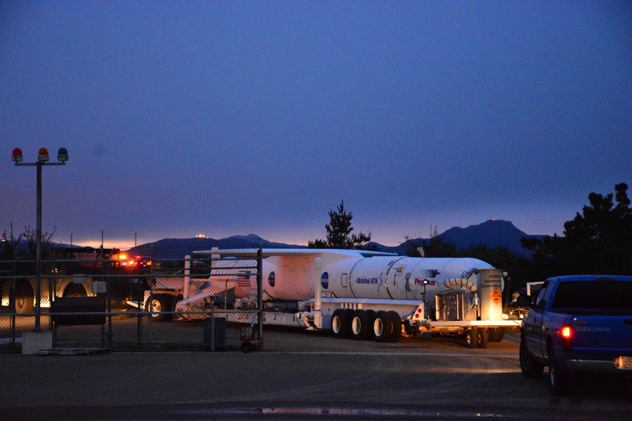 At Vandenberg Air Force Base in California, an Orbital ATK Pegasus XL rocket is transported from the hangar at Building 1555 to be mated to L-1011 carrier aircraft near Vandenberg's runway. On board Pegasus are eight NASA Cyclone Global Navigation Satellite System, or CYGNSS, spacecraft. When preparations are competed at Vandenberg, the L-1011/Pegasus XL combination will be flown to NASA’s Kennedy Space Center in Florida. On Dec. 12, 2016, the carrier aircraft is scheduled to take off from the Skid Strip at Cape Canaveral Air Force Station and CYGNSS will launch on the Pegasus XL rocket with the L-1011 flying off shore. CYGNSS satellites will make frequent and accurate measurements of ocean surface winds throughout the life cycle of tropical storms and hurricanes. The data that CYGNSS provides will enable scientists to probe key air-sea interaction processes that take place near the core of storms, which are rapidly changing and play a critical role in the beginning and intensification of hurricanes.