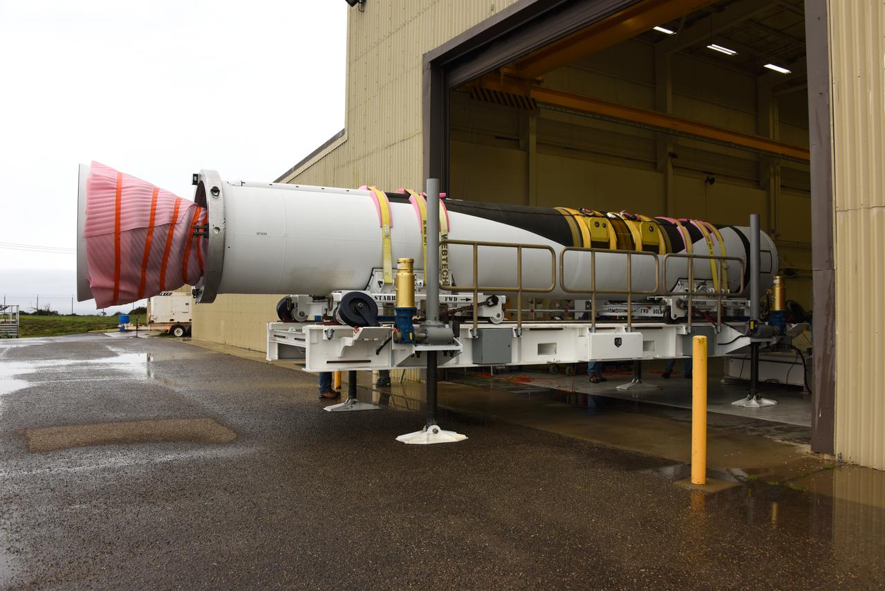 The first stage motor for the Orbital ATK Pegasus XL rocket is moved inside Building 1555 at Vandenberg Air Force Base in California. In the background are the second and third stage segments. The rocket is being prepared for NASA's Ionospheric Connection Explorer, or ICON, mission. ICON will launch from the Kwajalein Atoll aboard the Pegasus XL on Dec. 8, 2017. ICON will study the frontier of space - the dynamic zone high in Earth's atmosphere where terrestrial weather from below meets space weather above. The explorer will help determine the physics of Earth's space environment and pave the way for mitigating its effects on our technology, communications systems and society. 