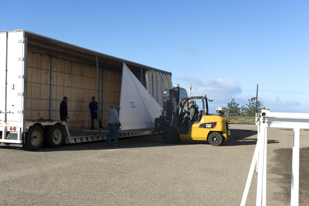 Workers unload the wing for the Orbital ATK Pegasus XL rocket from a truck at Building 1555 at Vandenberg Air Force Base in California. The rocket is being prepared for NASA's Ionospheric Connection Explorer, or ICON, mission. ICON will launch from the Kwajalein Atoll aboard the Pegasus XL on Dec. 8, 2017. ICON will study the frontier of space - the dynamic zone high in Earth's atmosphere where terrestrial weather from below meets space weather above. The explorer will help determine the physics of Earth's space environment and pave the way for mitigating its effects on our technology, communications systems and society. 