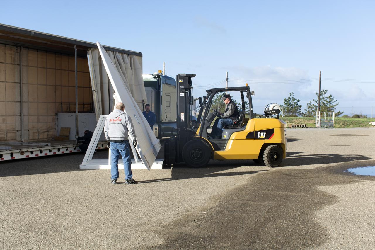 Workers transfer the wing for the Orbital ATK Pegasus XL rocket from a truck to a forklift at Building 1555 at Vandenberg Air Force Base in California. The rocket is being prepared for NASA's Ionospheric Connection Explorer, or ICON, mission. ICON will launch from the Kwajalein Atoll aboard the Pegasus XL on Dec. 8, 2017. ICON will study the frontier of space - the dynamic zone high in Earth's atmosphere where terrestrial weather from below meets space weather above. The explorer will help determine the physics of Earth's space environment and pave the way for mitigating its effects on our technology, communications systems and society. 