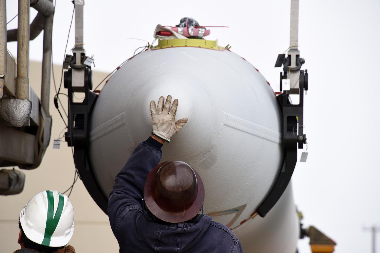 Technicians and engineers at Space Launch Complex 2 at Vandenberg Air Force Base in California, begin lifting a United Launch Alliance/Orbital ATK solid rocket motor for mating to a Delta II rocket in preparation for launch of the Joint Polar Satellite System-1 (JPSS-1) later this year. JPSS, a next-generation environmental satellite system, is a collaborative program between the National Oceanic and Atmospheric Administration (NOAA) and NASA.