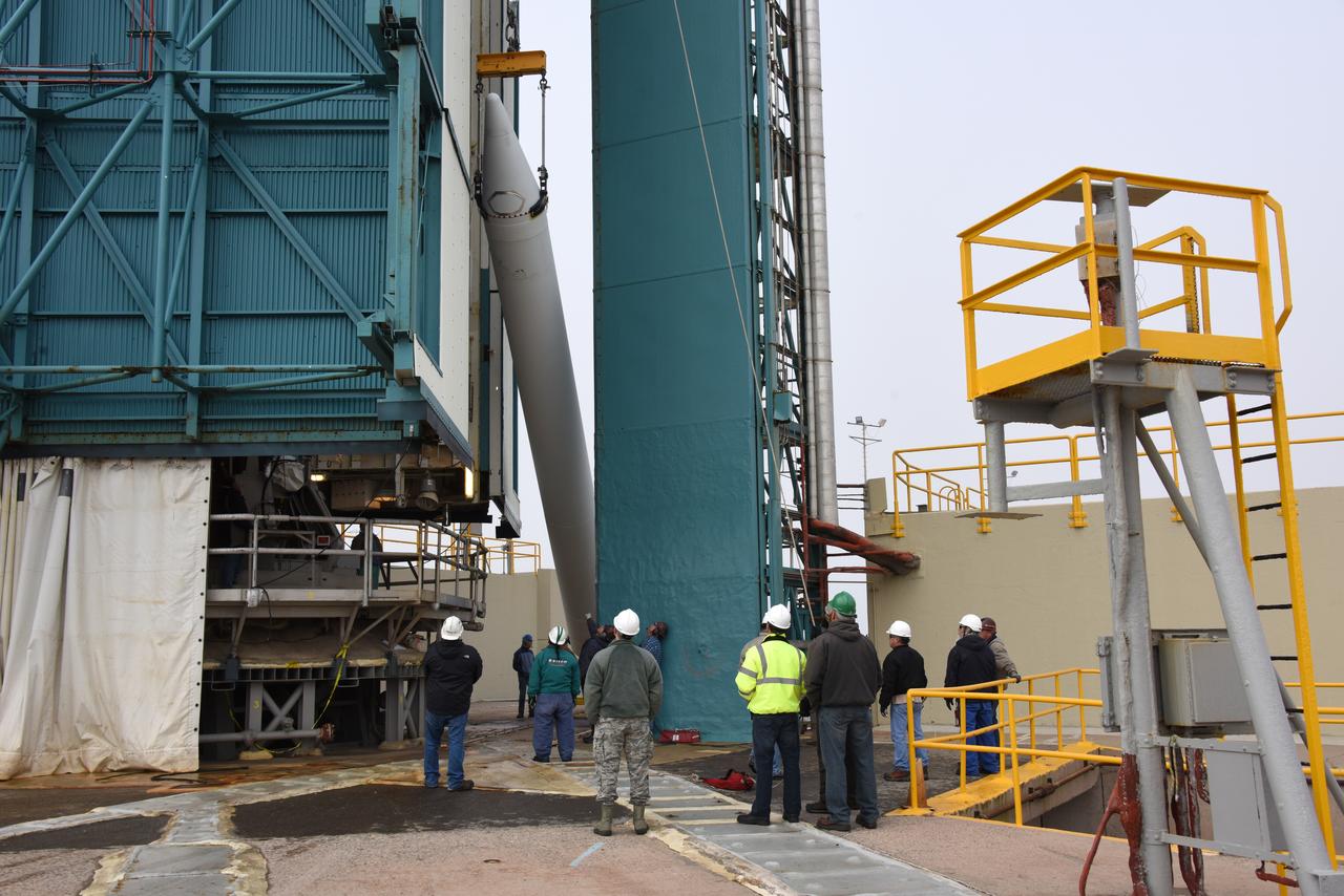 Technicians and engineers at Space Launch Complex 2 at Vandenberg Air Force Base in California, lift a United Launch Alliance/Orbital ATK solid rocket motor for mating to a Delta II rocket in preparation for launch of the Joint Polar Satellite System-1 (JPSS-1) later this year. JPSS, a next-generation environmental satellite system, is a collaborative program between the National Oceanic and Atmospheric Administration (NOAA) and NASA.