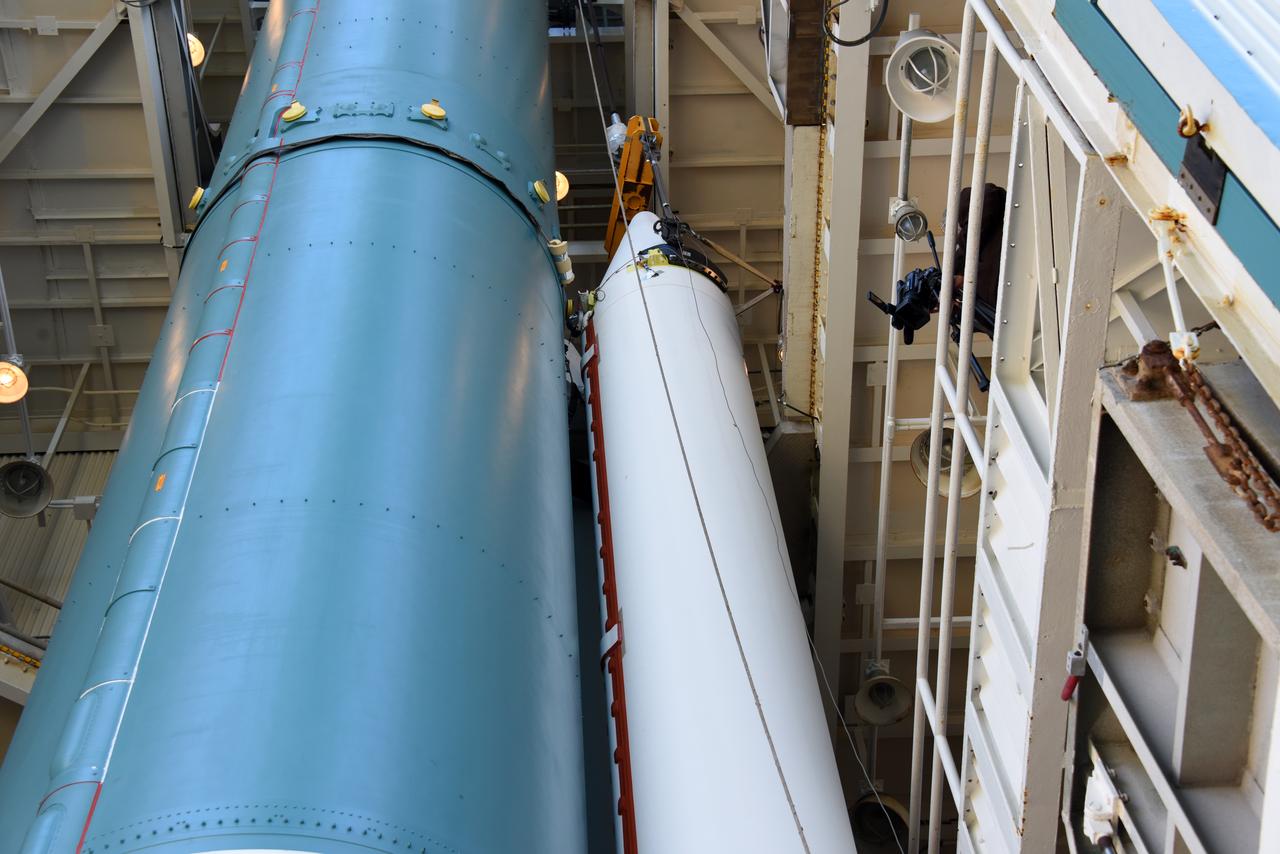 Technicians and engineers at Space Launch Complex 2 at Vandenberg Air Force Base in California, mate a United Launch Alliance/Orbital ATK solid rocket motor to a Delta II rocket in preparation for launch of the Joint Polar Satellite System-1 (JPSS-1) later this year. JPSS, a next-generation environmental satellite system, is a collaborative program between the National Oceanic and Atmospheric Administration (NOAA) and NASA.