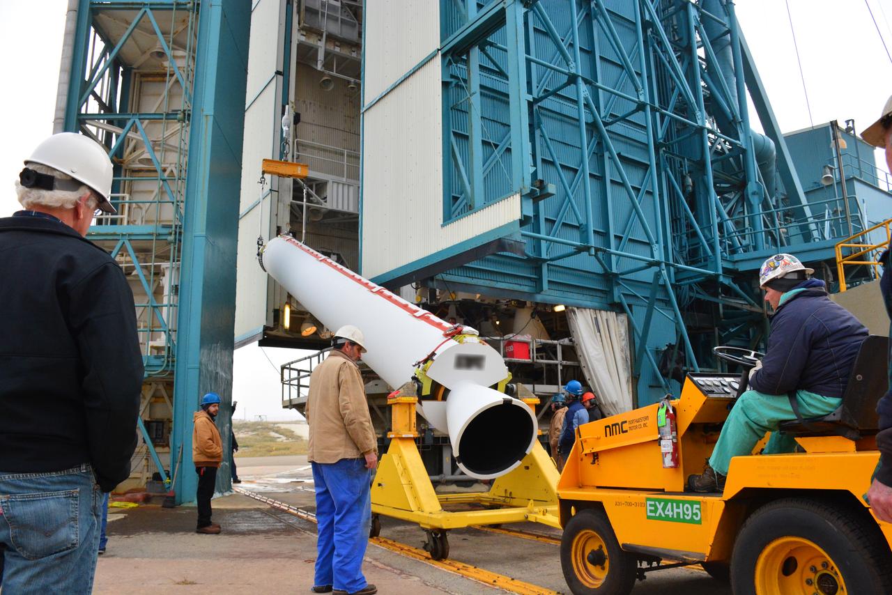 Technicians and engineers at Space Launch Complex 2 at Vandenberg Air Force Base in California, lift a United Launch Alliance/Orbital ATK solid rocket motor for mating to a Delta II rocket in preparation for launch of the Joint Polar Satellite System-1 (JPSS-1) later this year. JPSS, a next-generation environmental satellite system, is a collaborative program between the National Oceanic and Atmospheric Administration (NOAA) and NASA.