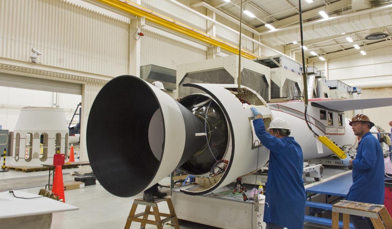 A technician installs the aft skirt on the Orbital ATK Pegasus XL rocket July 8, 2017, inside Building 1555 at Vandenberg Air Force Base in California. When the aft skirt is installed, the rudder and fins can be installed. The Pegasus rocket is being prepared for NASA's Ionospheric Connection Explorer, or ICON, mission. The explorer will launch on June 15, 2018, from Kwajalein Atoll in the Marshall Islands (June 14 in the continental United States) on Orbital ATKS's Pegasus XL, which is attached to the company's L-1011 Stargazer aircraft. ICON will study the frontier of space - the dynamic zone high in Earth's atmosphere where terrestrial weather from below meets space weather above. The explorer will help determine the physics of Earth's space environment and pave the way for mitigating its effects on our technology, communications systems and society.