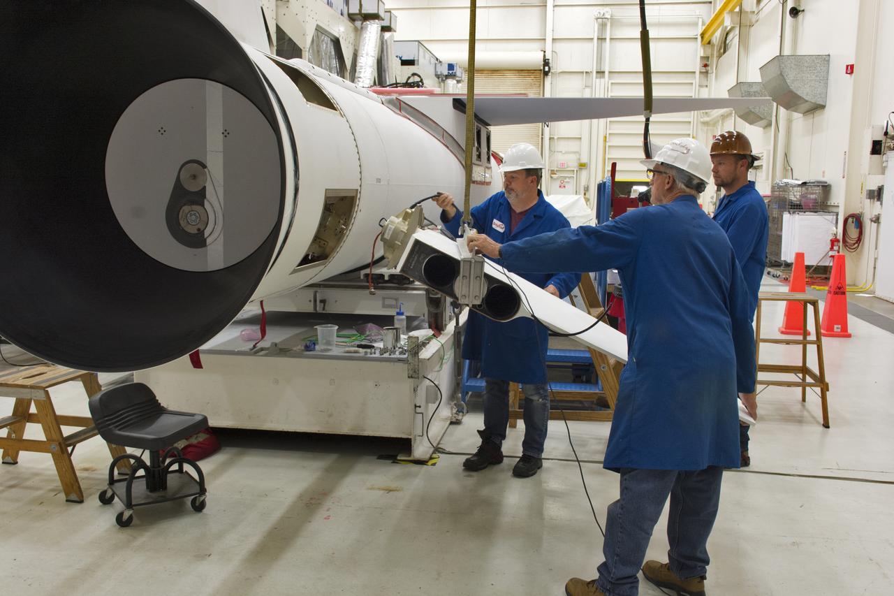Technicians install the starboard fin on the Orbital ATK Pegasus XL rocket July 8, 2017, inside Building 1555 at Vandenberg Air Force Base in California. The Pegasus rocket is being prepared for NASA's Ionospheric Connection Explorer, or ICON, mission. ICON will launch on June 15 from Kwajalein Atoll in the Marshall Islands (June 14 in the continental United States) on Orbital ATK's Pegasus XL rocket, which is attached to the company's L-1011 Stargazer aircraft. ICON will study the frontier of space - the dynamic zone high in Earth's atmosphere where terrestrial weather from below meets space weather above. The explorer will help determine the physics of Earth's space environment and pave the way for mitigating its effects on our technology, communications systems and society.