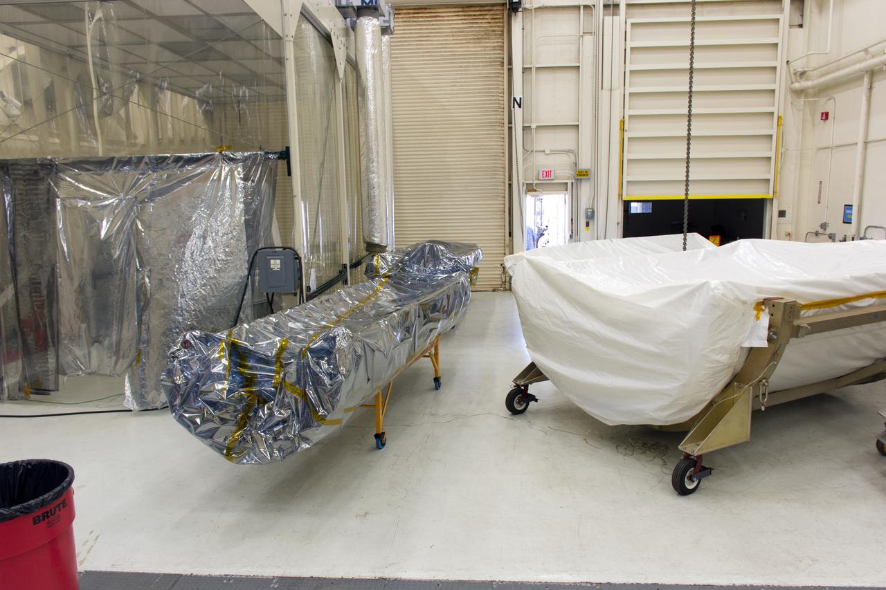 The first half of the payload fairing for the Orbital ATK Pegasus XL rocket is inside Building 1555 at Vandenberg Air Force Base in California on Aug. 4, 2018. The Pegasus rocket is being prepared for NASA's Ionospheric Connection Explorer, or ICON, mission. The explorer will launch on June 15, 2018, from Kwajalein Atoll in the Marshall Islands (June 14 in the continental United States) on Orbital ATK's Pegasus XL rocket, which is attached to the company's L-1011 Stargazer aircraft. ICON will study the frontier of space - the dynamic zone high in Earth's atmosphere where terrestrial weather from below meets space weather above. The explorer will help determine the physics of Earth's space environment and pave the way for mitigating its effects on our technology, communications systems and society.