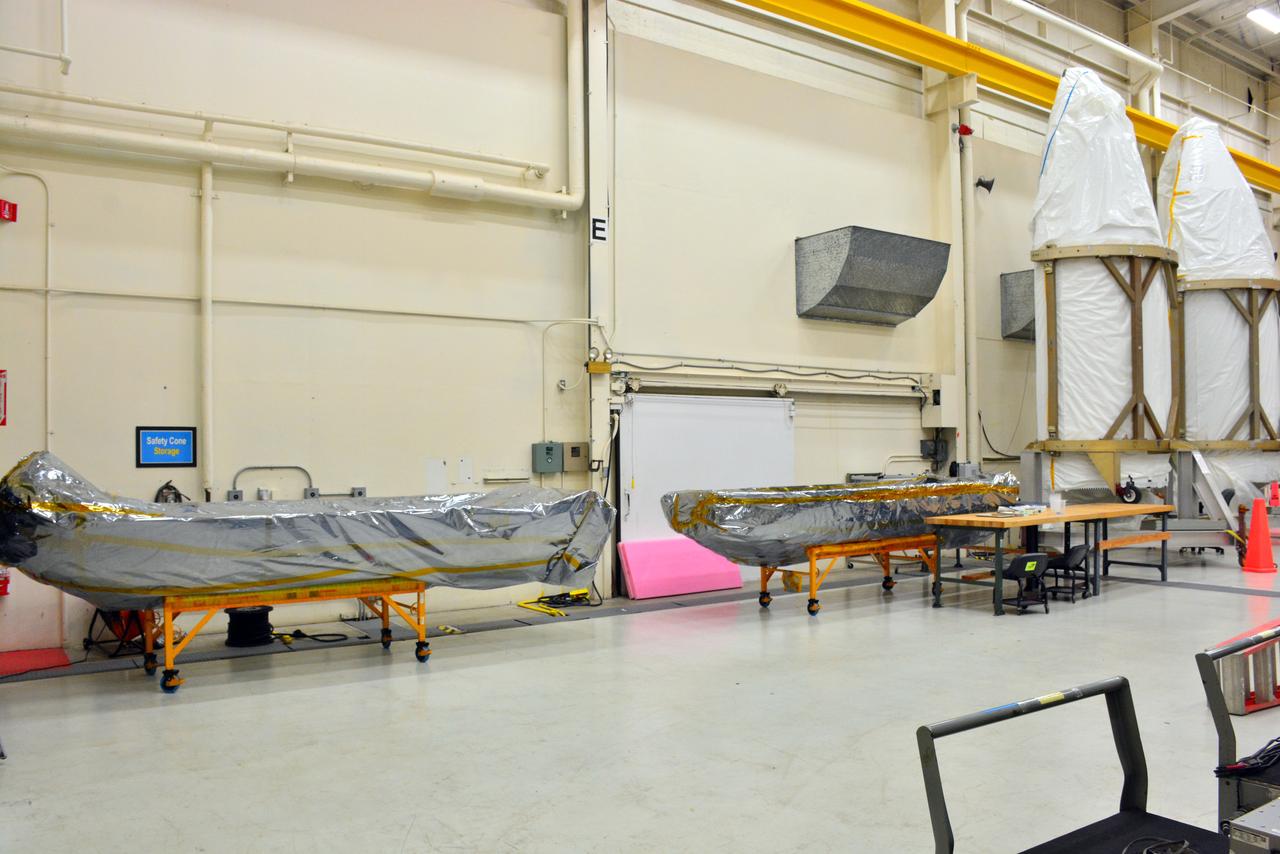 The payload fairing halves for Orbital ATK's Pegasus XL rocket are staged inside Building 1555 at Vandenberg Air Force Base in California on Aug. 23, 2017. The Pegasus rocket is being prepared for NASA's Ionospheric Connection Explorer (ICON) mission. The explorer will launch on June 15, 2018, from Kwajalein Atoll in the Marshall Islands (June 14 in the continental United States) on the Pegasus XL, which is attached to the company's L-1011 Stargazer aircraft. ICON will study the frontier of space - the dynamic zone high in Earth's atmosphere where terrestrial weather from below meets space weather above. The explorer will help determine the physics of Earth's space environment and pave the way for mitigating its effects on our technology, communications systems and society.