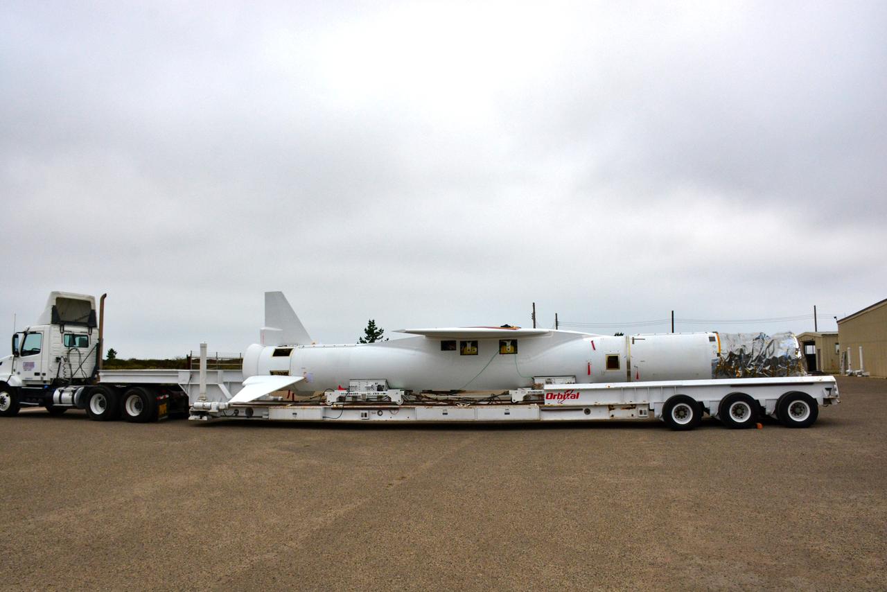 The Orbital ATK Pegasus XL rocket, with NASA's Ionospheric Connection Explorer (ICON) spacecraft attached, is moved on an assembly integration trailer from one high bay to another Aug. 23, 2017, at Building 1555 at Vandenberg Air Force Base in California. The Pegasus rocket is being prepared for the ICON mission. The explorer will launch on June 15, 2018, from Kwajalein Atoll in the Marshall Islands (June 14 in the continental United States) on the Pegasus XL, which is attached to the company's L-1011 Stargazer aircraft. ICON will study the frontier of space - the dynamic zone high in Earth's atmosphere where terrestrial weather from below meets space weather above. The explorer will help determine the physics of Earth's space environment and pave the way for mitigating its effects on our technology and communications systems.