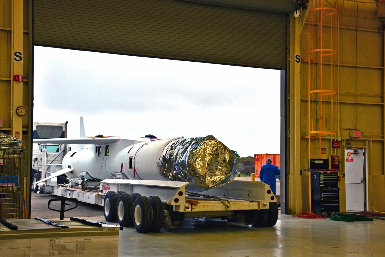 The Orbital ATK Pegasus XL rocket, with NASA's Ionospheric Connection Explorer (ICON) spacecraft attached, is moved on an assembly integration trailer into another high bay Aug. 23, 2017, at Building 1555 at Vandenberg Air Force Base in California. The Pegasus rocket is being prepared for the ICON mission. The explorer will launch on June 15, 2018, from Kwajalein Atoll in the Marshall Islands (June 14 in the continental United States) on the Pegasus XL, which is attached to the company's L-1011 Stargazer aircraft. ICON will study the frontier of space - the dynamic zone high in Earth's atmosphere where terrestrial weather from below meets space weather above. The explorer will help determine the physics of Earth's space environment and pave the way for mitigating its effects on our technology and communications systems.