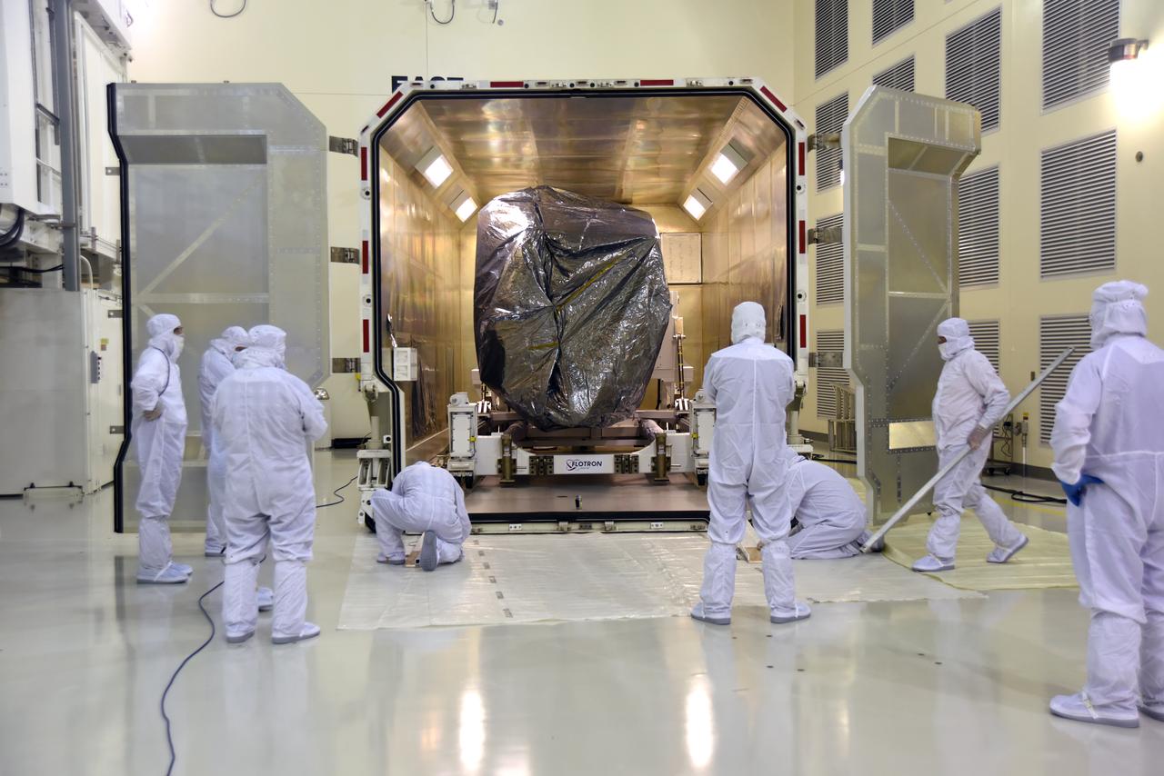 Inside the Astrotech Processing Facility at Vandenberg Air Force Base in California, technicians and engineers remove the Joint Polar Satellite System-1, or JPSS-1 from it shipping container. JPSS is the first in a series four next-generation environmental satellites in a collaborative program between the National Oceanic and Atmospheric Administration (NOAA) and NASA. The satellite is scheduled to liftoff Nov. 10, 2017 atop a United Launch Alliance Delta II rocket.