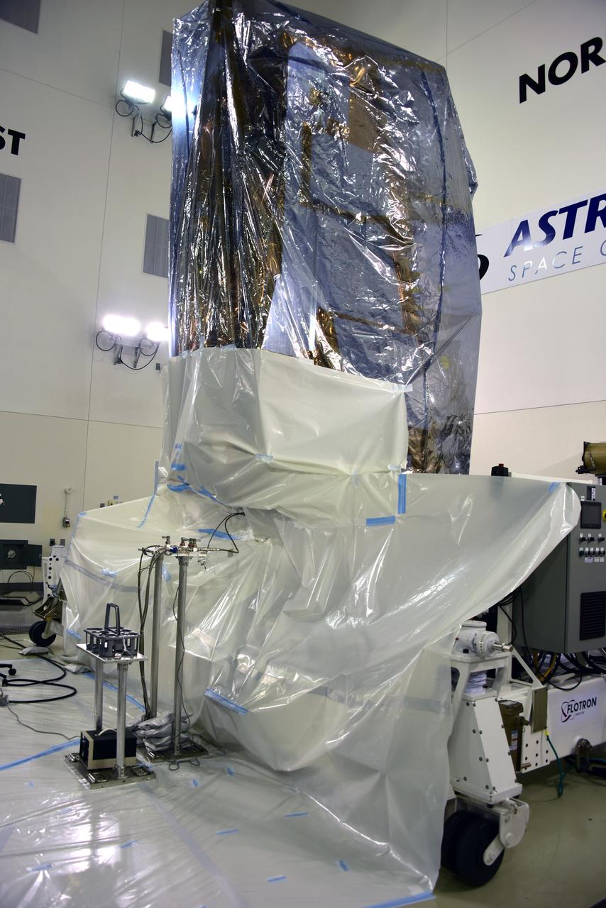 NOAA's Joint Polar Satellite System-1, or JPSS-1, remains wrapped in a protective covering after removal from its shipping container at the Astrotech Processing Facility at Vandenberg Air Force Base in California. The spacecraft is being prepared for its upcoming liftoff aboard a United Launch Alliance Delta II rocket from Vandenberg's Space Launch Complex-2W. JPSS-1 is the first in a series four next-generation environmental satellites in a collaborative program between NOAA and NASA.