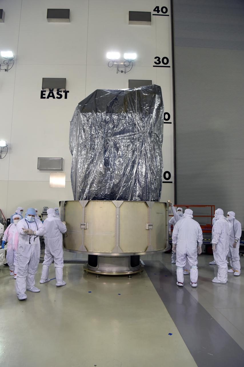 In the Astrotech Processing Facility at Vandenberg Air Force Base in California, the Joint Polar Satellite System-1, or JPSS-1, spacecraft is wrapped in a protective covering prior to technicians and engineers placing it in a protective container. It then will be mounted on a transport trailer for its move to Space Launch Complex 2. At the pad, JPSS-1 will be lifted for mating atop a United Launch Alliance Delta II rocket. Built by Ball Aerospace and Technologies Corp. of Boulder, Colorado, JPSS is the first in a series four next-generation environmental satellites in a collaborative program between the NOAA and NASA. Liftoff is scheduled to take place from Vandenberg's Space Launch Complex 2.