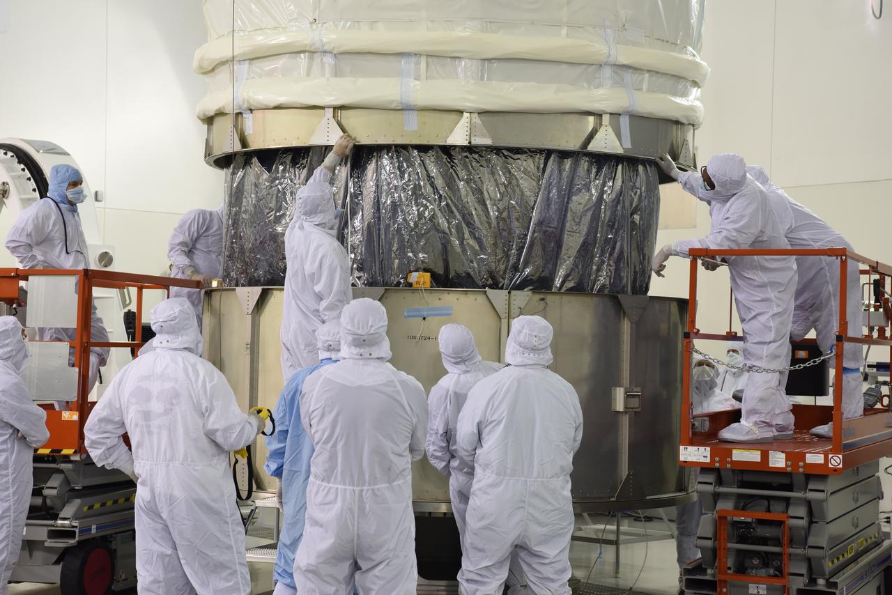 In the Astrotech Processing Facility at Vandenberg Air Force Base in California, technicians and engineers place the Joint Polar Satellite System-1, or JPSS-1, spacecraft in a protective container. It then will be mounted on a transport trailer for its move to Space Launch Complex 2. At the pad, JPSS-1 will be lifted for mating atop a United Launch Alliance Delta II rocket. Built by Ball Aerospace and Technologies Corp. of Boulder, Colorado, JPSS is the first in a series four next-generation environmental satellites in a collaborative program between the NOAA and NASA. Liftoff is scheduled to take place from Vandenberg's Space Launch Complex 2.