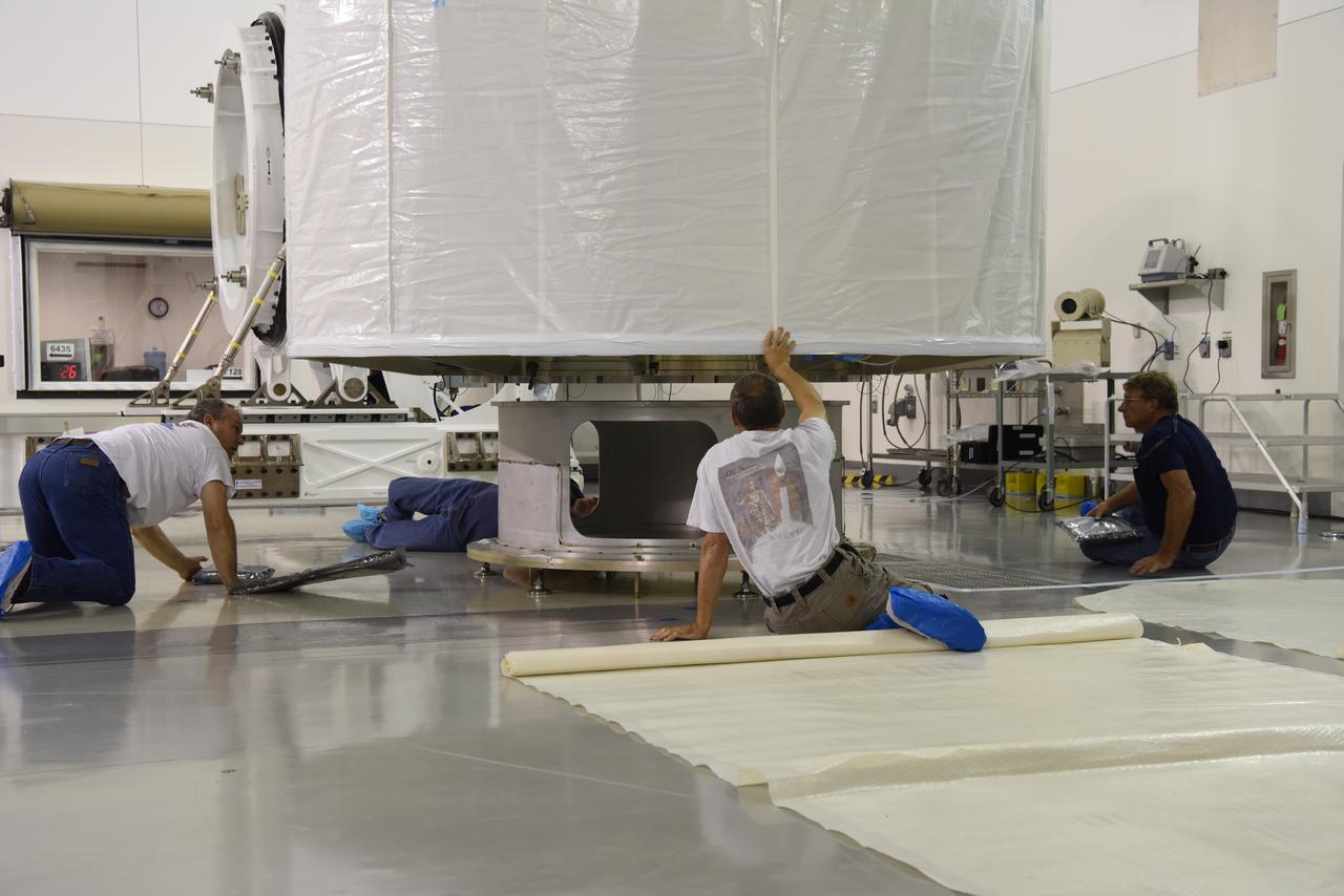 In the Astrotech Processing Facility at Vandenberg Air Force Base in California, the Joint Polar Satellite System-1, or JPSS-1, spacecraft is prepared for departure in a protective container to Space Launch Complex 2. At the pad, JPSS-1 will be lifted for mating atop a United Launch Alliance Delta II rocket. Built by Ball Aerospace and Technologies Corp. of Boulder, Colorado, JPSS is the first in a series four next-generation environmental satellites in a collaborative program between the NOAA and NASA. Liftoff is scheduled to take place from Vandenberg's Space Launch Complex 2.