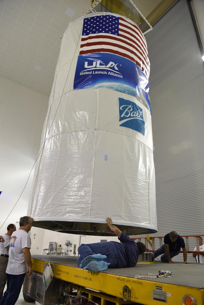 In the Astrotech Processing Facility at Vandenberg Air Force Base in California, the Joint Polar Satellite System-1, or JPSS-1, spacecraft in a protective container is placed on a transport trailer for the trip to Space Launch Complex 2. At the pad, JPSS-1 will be lifted for mating atop a United Launch Alliance Delta II rocket. Built by Ball Aerospace and Technologies Corp. of Boulder, Colorado, JPSS is the first in a series four next-generation environmental satellites in a collaborative program between the NOAA and NASA. Liftoff is scheduled to take place from Vandenberg's Space Launch Complex 2.