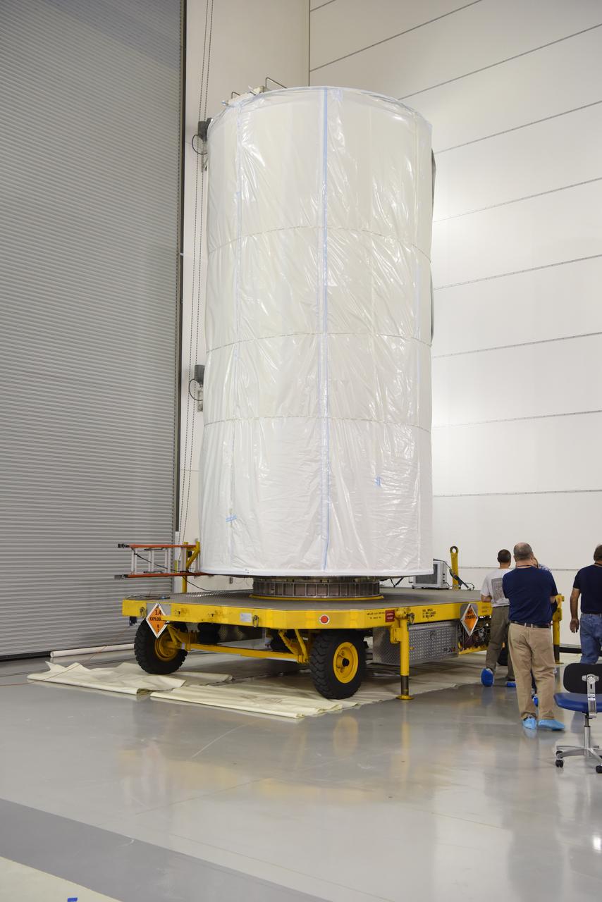 In the Astrotech Processing Facility at Vandenberg Air Force Base in California, the Joint Polar Satellite System-1, or JPSS-1, spacecraft in a protective container is mounted on a transport trailer for the trip to Space Launch Complex 2. At the pad, JPSS-1 will be lifted for mating atop a United Launch Alliance Delta II rocket. Built by Ball Aerospace and Technologies Corp. of Boulder, Colorado, JPSS is the first in a series four next-generation environmental satellites in a collaborative program between the NOAA and NASA. Liftoff is scheduled to take place from Vandenberg's Space Launch Complex 2.