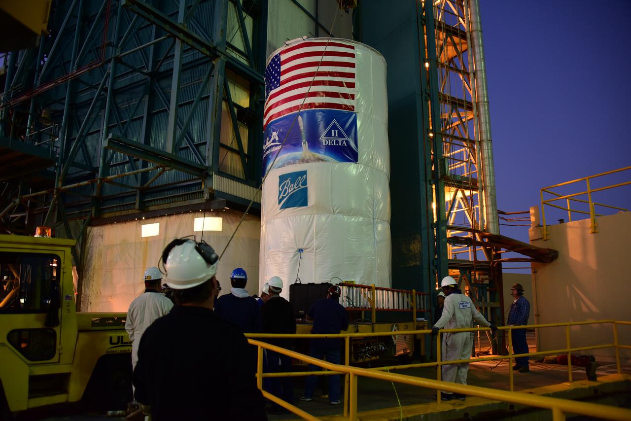 Packaged in a protective container, the Joint Polar Satellite System-1, or JPSS-1, spacecraft is about to be lifted and mated atop a United Launch Alliance Delta II rocket at Space Launch Complex 2 at Vandenberg Air Force Base in California. Built by Ball Aerospace and Technologies Corp. of Boulder, Colorado, JPSS is the first in a series four next-generation environmental satellites in a collaborative program between the NOAA and NASA. Liftoff is scheduled to take place from Vandenberg's Space Launch Complex 2.