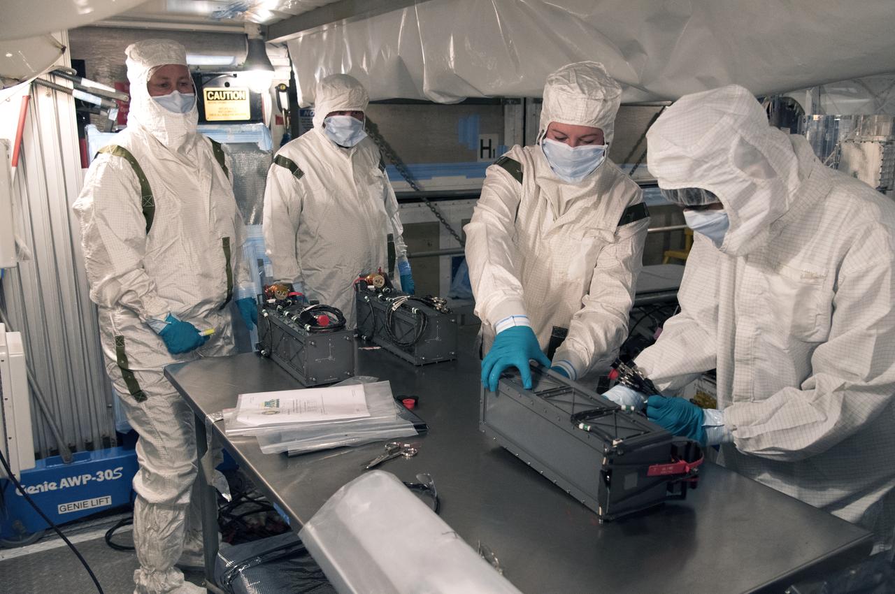 At Vandenberg Air Force Base in California, technicians and engineers prepare a Poly Picosatellite Orbital Deployer, or P-POD, container for installation on the Joint Polar Satellite System-1, or JPSS-1, spacecraft. P-PODS are auxiliary payloads launched aboard NASA expendable launch vehicles carrying up to three small CubeSats. The small cube-shaped satellites are part of NASA’s Educational Launch of Nanosatellite, or ELaNa, missions. The small payloads are designed and built by students from high school-level classes up to college and university students. JPSS is the first in a series of four next-generation environmental satellites in a collaborative program between the NOAA and NASA. Liftoff from Vandenberg's Space Launch Compex-2 atop a United Launch Alliance Delta II rocket is scheduled for 1:47 a.m. PST (4:47 a.m. EST), on Nov. 14, 2017.