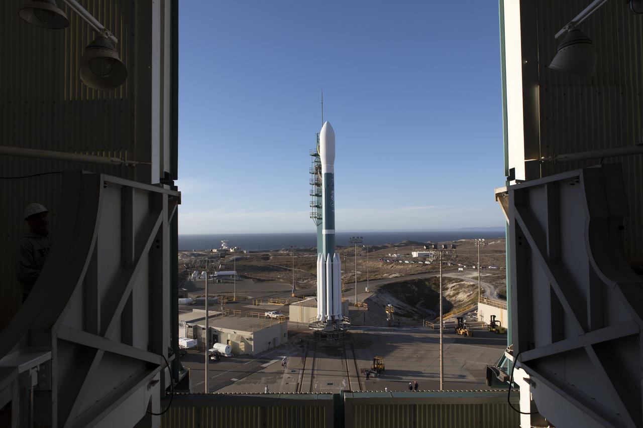 At Vandenberg Air Force Base in California, the gantry rolls back at Space Launch Complex 2 in preparation for the liftoff of the Joint Polar Satellite System-1, or JPSS-1, spacecraft. The United Launch Alliance Delta II rocket now is poised to boost the satellite to a polar orbit. Built by Ball Aerospace and Technologies Corp. of Boulder, Colorado, JPSS is the first in a series four next-generation environmental satellites in a collaborative program between NOAA and NASA. The satellite is scheduled to liftoff at 1:47 a.m. PST (4:47 a.m. EST), on Nov. 14, 2017.