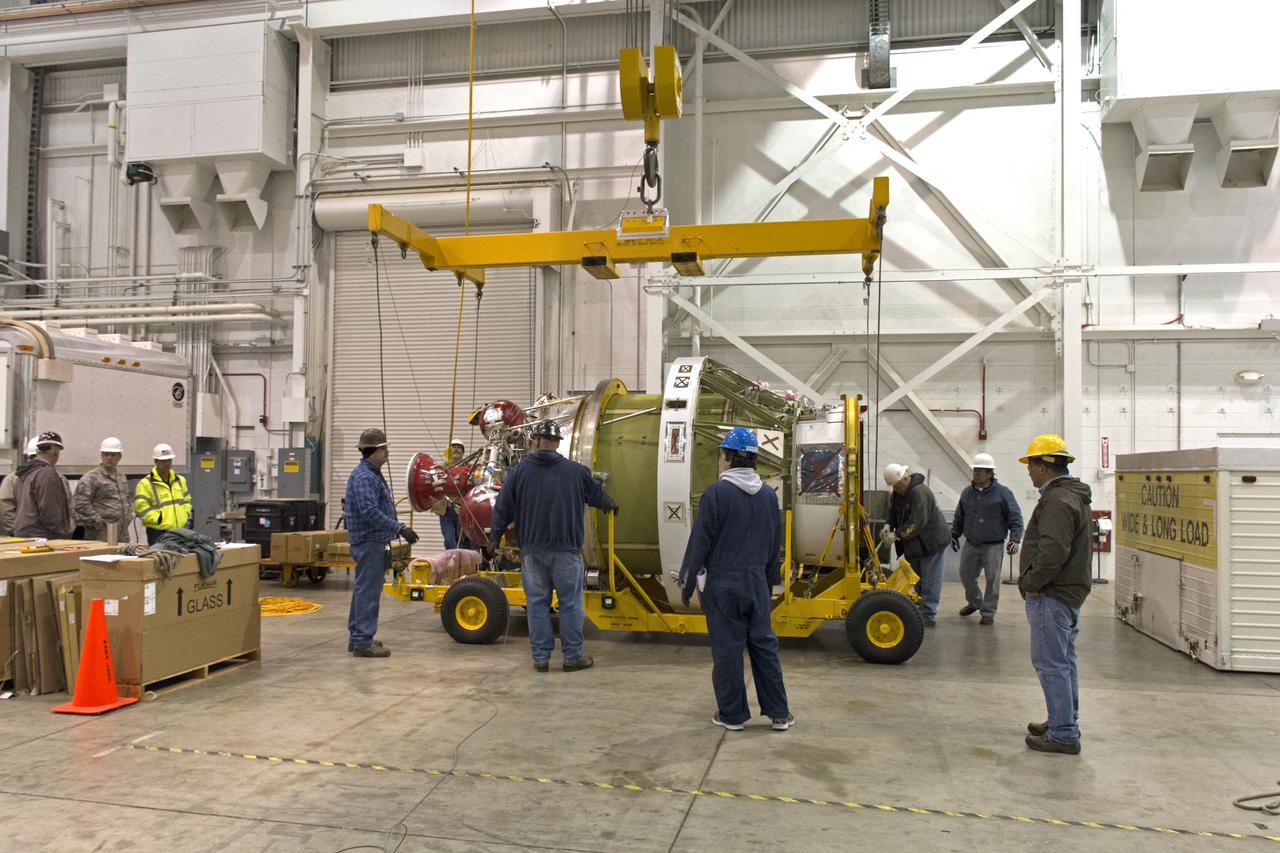 Inside NASA's Building 1555 at Vandenberg Air Force Base in California, the United Launch Alliance Delta II second stage was lifted out of its shipping container and a crane is being used to lower it onto the base of a transporter. The second stage will be moved to the horizontal processing facility at Space Launch Complex-2. NASA's Ice, Cloud and land Elevation Satellite-2 (ICESat-2) will launch later this year on the final Delta II rocket. ICESat-2 will measure the height of a changing Earth, one laser pulse at a time, 10,000 laser pulses a second. The satellite will carry a single instrument, the Advanced Topographic Laser Altimeter System. ICESat-2 will help scientists investigate why, and how much our planet's frozen and icy areas, called the cryosphere, is changing in a warming climate. 