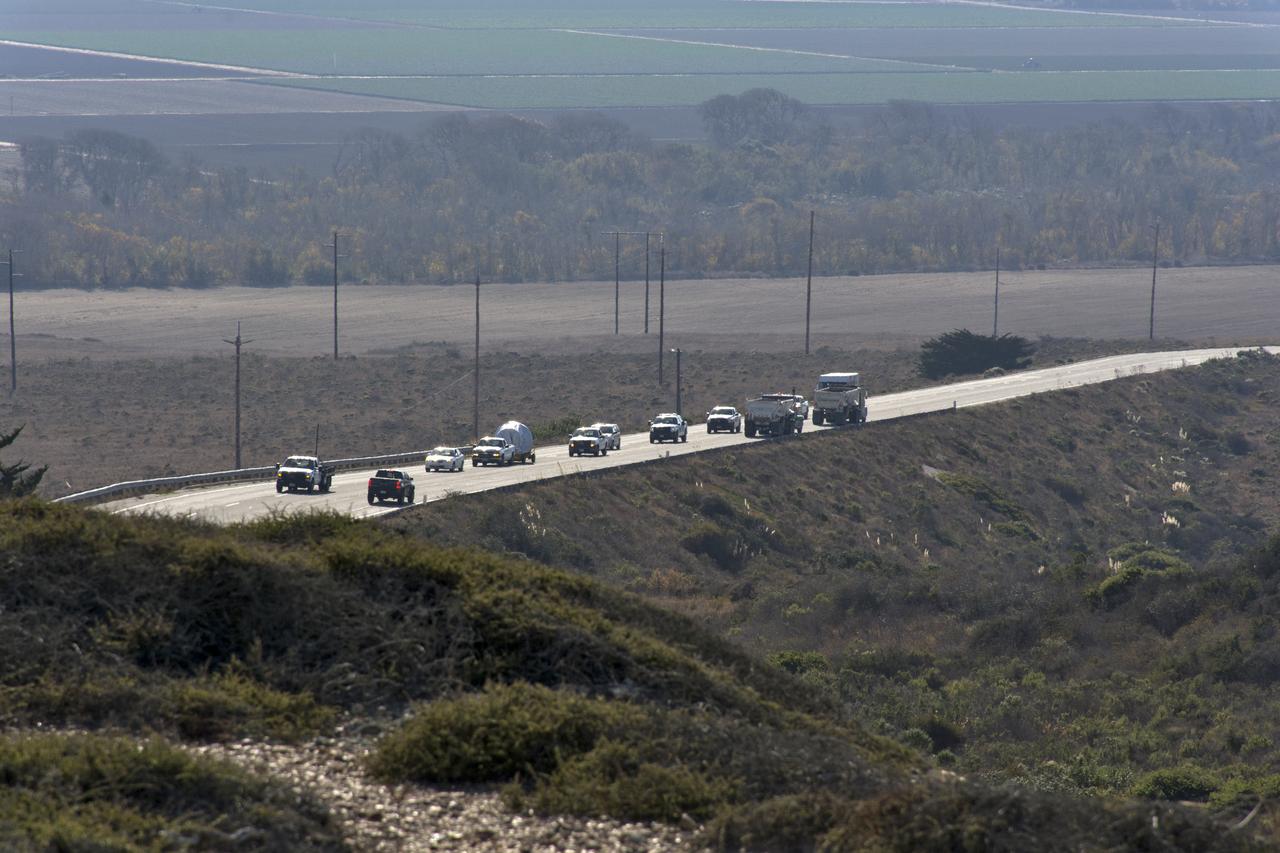 A convoy of vehicles accompanies the United Launch Alliance Delta II second stage on its way to the horizontal processing facility at Space Launch Complex-2 at Vandenberg Air Force Base in California. NASA's Ice, Cloud and land Elevation Satellite-2 (ICESat-2) will launch later this year on the final Delta II rocket. ICESat-2 will measure the height of a changing Earth, one laser pulse at a time, 10,000 laser pulses a second. The satellite will carry a single instrument, the Advanced Topographic Laser Altimeter System. ICESat-2 will help scientists investigate why, and how much our planet's frozen and icy areas, called the cryosphere, is changing in a warming climate. 