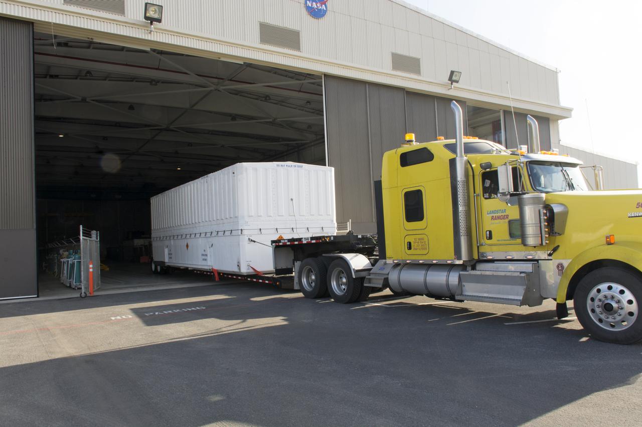 A flatbed truck, carrying the payload fairing for the United Launch Alliance (ULA) Delta II rocket, arrives at Building 836 at Vandenberg Air Force Base in California. NASA's Ice, Cloud and land Elevation Satellite-2 (ICESat-2) is scheduled to launch on the final ULA Delta II rocket later this year. ICESat-2 will measure the height of a changing Earth, one laser pulse at a time, 10,000 laser pulses a second. The satellite will carry a single instrument, the Advanced Topographic Laser Altimeter System. ICESat-2 will help scientists investigate why, and how much our planet's frozen and icy areas, called the cryosphere, is changing in a warming climate. 