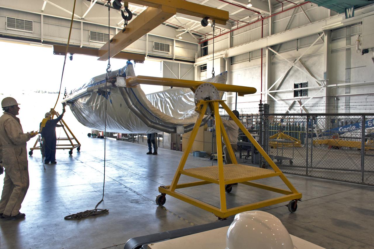 Inside Building 836 at Vandenberg Air Force Base in California, the first half of the payload fairing for the United Launch Alliance (ULA) Delta II rocket has been lifted out of its shipping container. NASA's Ice, Cloud and land Elevation Satellite-2 (ICESat-2) is scheduled to launch on the final ULA Delta II rocket later this year. ICESat-2 will measure the height of a changing Earth, one laser pulse at a time, 10,000 laser pulses a second. The satellite will carry a single instrument, the Advanced Topographic Laser Altimeter System. ICESat-2 will help scientists investigate why, and how much our planet's frozen and icy areas, called the cryosphere, is changing in a warming climate.