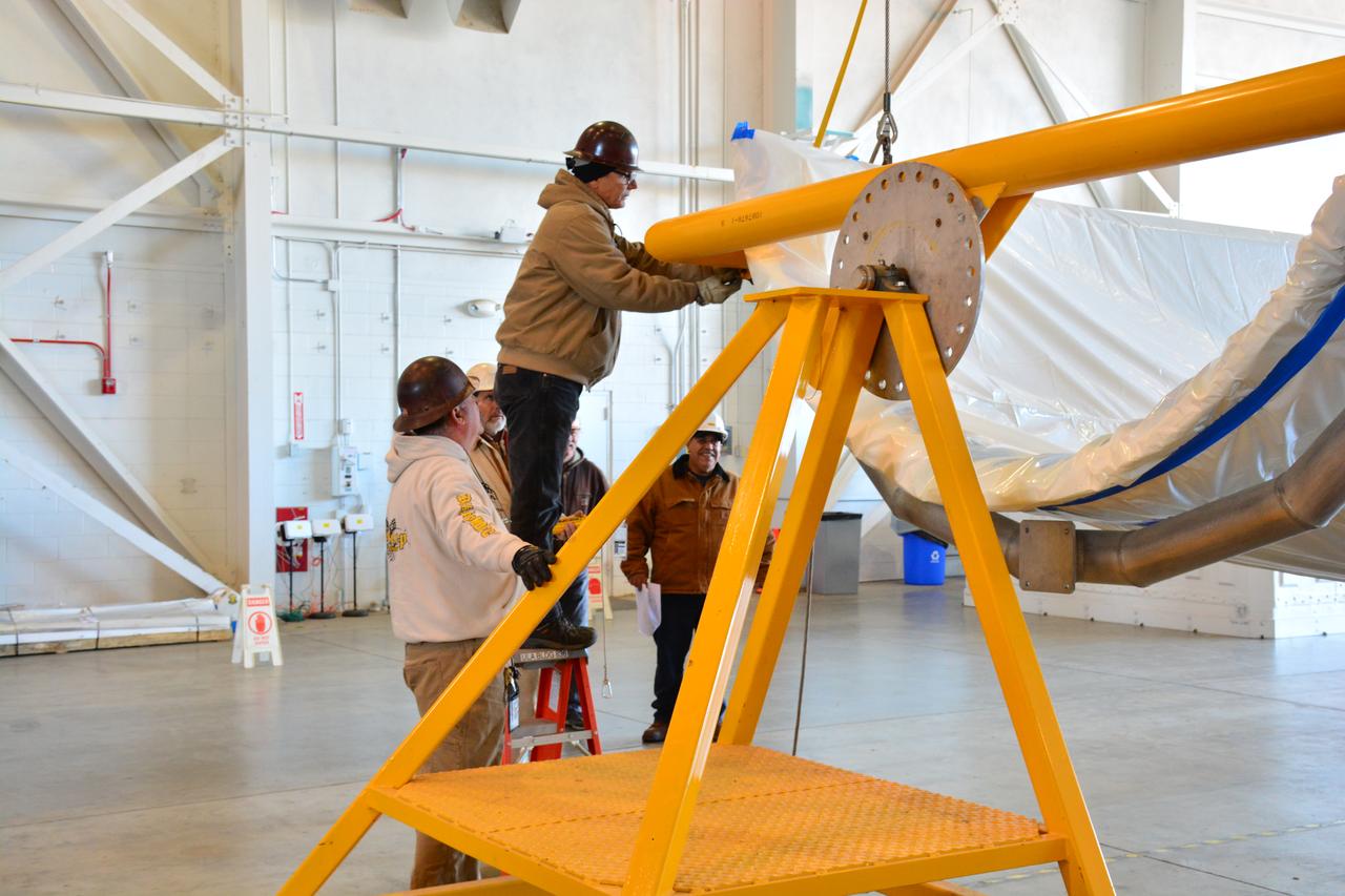 Inside Building 836 at Vandenberg Air Force Base in California, the first half of the payload fairing for the United Launch Alliance (ULA) Delta II rocket has been lifted out of its shipping container. NASA's Ice, Cloud and land Elevation Satellite-2 (ICESat-2) is scheduled to launch on the final ULA Delta II rocket later this year. ICESat-2 will measure the height of a changing Earth, one laser pulse at a time, 10,000 laser pulses a second. The satellite will carry a single instrument, the Advanced Topographic Laser Altimeter System. ICESat-2 will help scientists investigate why, and how much our planet's frozen and icy areas, called the cryosphere, is changing in a warming climate.