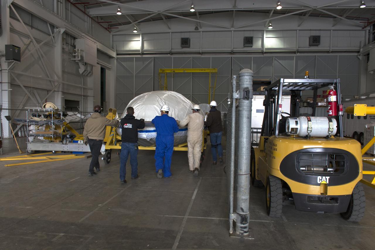 Inside Building 836 at Vandenberg Air Force Base in California, both halves of the payload fairing for the United Launch Alliance (ULA) Delta II rocket were lifted out of their shipping container and lowered onto a rolling work stand. NASA's Ice, Cloud and land Elevation Satellite-2 (ICESat-2) is scheduled to launch on the final ULA Delta II rocket later this year. ICESat-2 will measure the height of a changing Earth, one laser pulse at a time, 10,000 laser pulses a second. The satellite will carry a single instrument, the Advanced Topographic Laser Altimeter System. ICESat-2 will help scientists investigate why, and how much our planet's frozen and icy areas, called the cryosphere, is changing in a warming climate. 