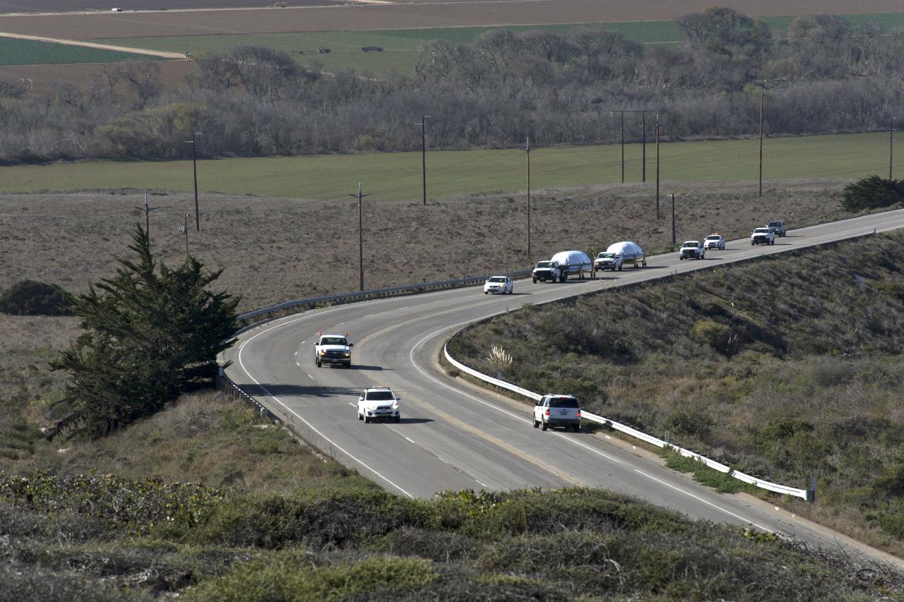 Both halves of the United Launch Alliance (ULA) Delta II rocket payload fairing are transported by convoy to ULA's Building B8337 at Vandenberg Air Force Base in California. NASA's Ice, Cloud and land Elevation Satellite-2 (ICESat-2) will launch later this year on the final Delta II rocket. ICESat-2 will measure the height of a changing Earth, one laser pulse at a time, 10,000 laser pulses a second. The satellite will carry a single instrument, the Advanced Topographic Laser Altimeter System. ICESat-2 will help scientists investigate why, and how much our planet's frozen and icy areas, called the cryosphere, is changing in a warming climate. 