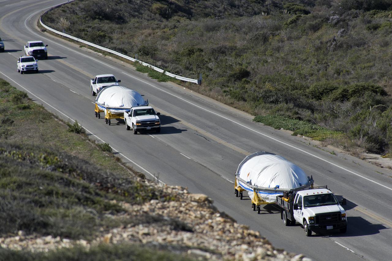 Both halves of the United Launch Alliance (ULA) Delta II rocket payload fairing are transported by convoy to ULA's Building B8337 at Vandenberg Air Force Base in California. NASA's Ice, Cloud and land Elevation Satellite-2 (ICESat-2) will launch later this year on the final Delta II rocket. ICESat-2 will measure the height of a changing Earth, one laser pulse at a time, 10,000 laser pulses a second. The satellite will carry a single instrument, the Advanced Topographic Laser Altimeter System. ICESat-2 will help scientists investigate why, and how much our planet's frozen and icy areas, called the cryosphere, is changing in a warming climate. 