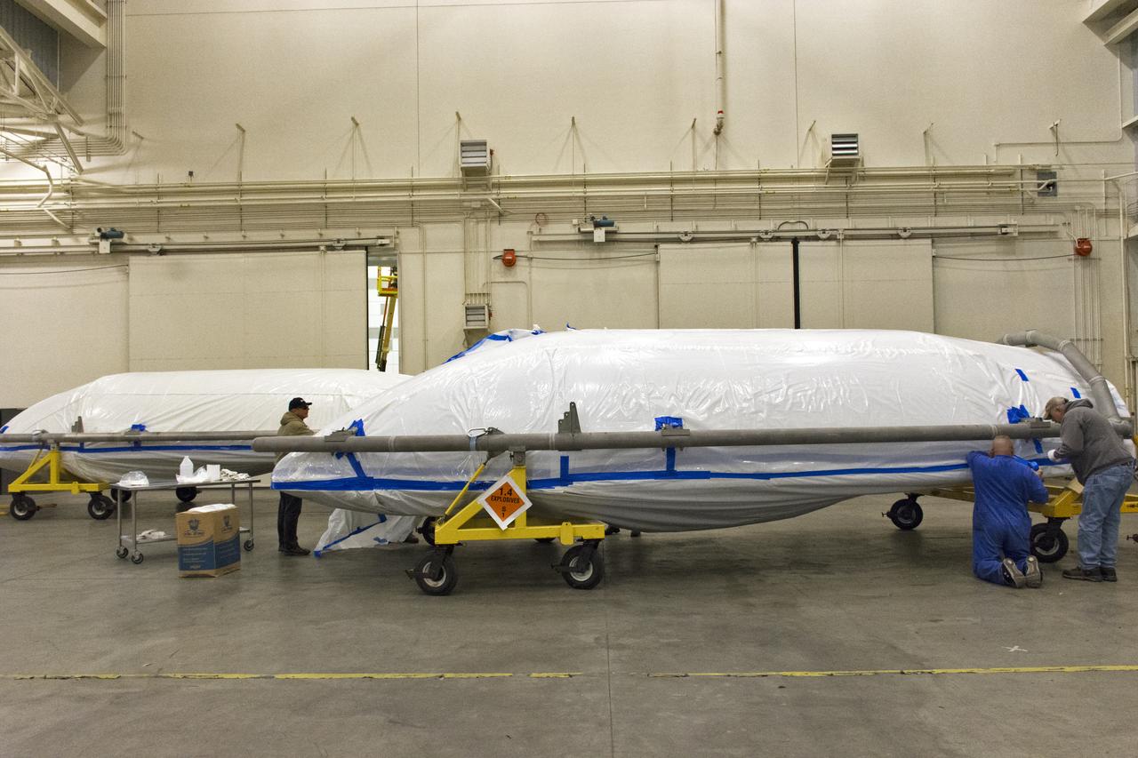 Both halves of the United Launch Alliance (ULA) Delta II rocket payload fairing were moved inside ULA's Building B8337 at Vandenberg Air Force Base in California. Technicians begin the process to remove them from their transporters. NASA's Ice, Cloud and land Elevation Satellite-2 (ICESat-2) will launch later this year on the final Delta II rocket. ICESat-2 will measure the height of a changing Earth, one laser pulse at a time, 10,000 laser pulses a second. The satellite will carry a single instrument, the Advanced Topographic Laser Altimeter System. ICESat-2 will help scientists investigate why, and how much our planet's frozen and icy areas, called the cryosphere, is changing in a warming climate. 