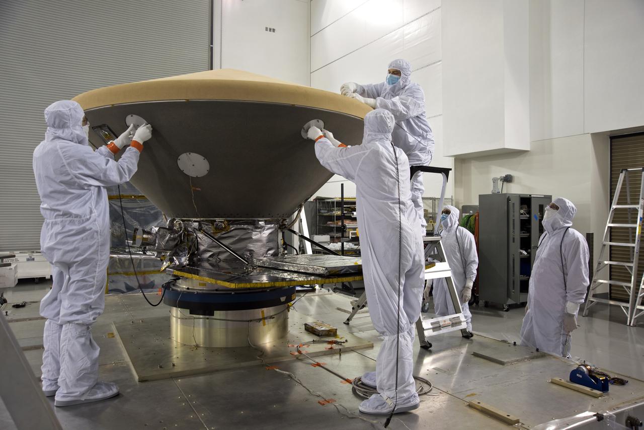 Inside the Astrotech processing facility at Vandenberg Air Force Base in California, technicians and engineers inspect the heatshield for NASA's Interior Exploration using Seismic Investigations, Geodesy and Heat Transport, or InSight, spacecraft. InSight was developed and built by Lockheed-Martin Space Systems in Denver, Colorado, and is scheduled for liftoff is May 5, 2018. InSight is the first mission to land on Mars and explore the Red Planet's deep interior. It will investigate processes that shaped the rocky planets of the inner solar system including Earth.