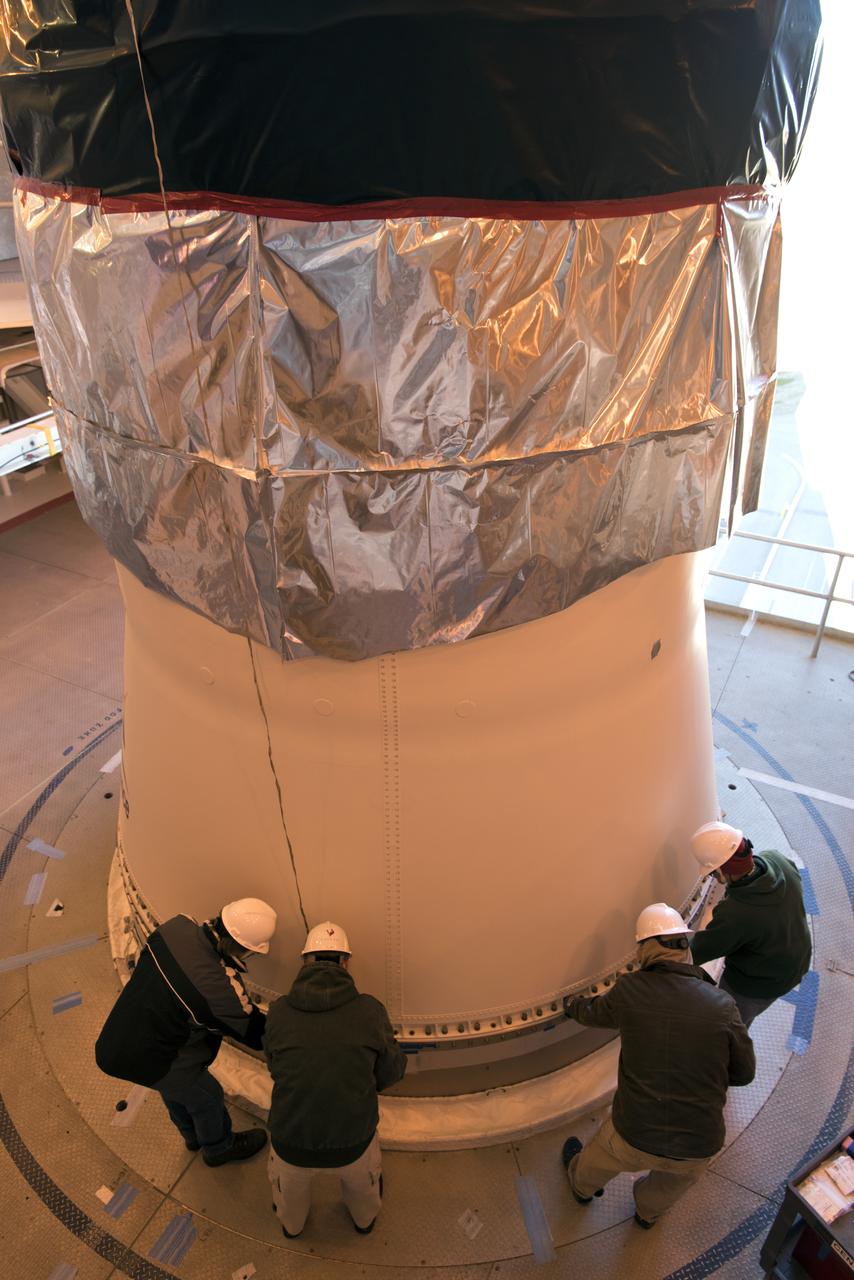 At Space Launch Complex 3 at Vandenberg Air Force Base in California, technicians and engineers mate the aft stub adapter (ASA) and interstage adapter (ISA) for a United Launch Alliance (ULA) Atlas V to a Centaur upper stage. The launch vehicle will send NASA's Interior Exploration using Seismic Investigations, Geodesy and Heat Transport, or InSight, spacecraft to land on Mars. InSight is the first mission to explore the Red Planet's deep interior. InSight is scheduled for liftoff May 5, 2018. InSight will be the first mission to look deep beneath the Martian surface. It will study the planet's interior by measuring its heat output and listen for marsquakes. InSight will use the seismic waves generated by marsquakes to develop a map of the planet’s deep interior. The resulting insight into Mars’ formation will provide a better understanding of how other rocky planets, including Earth, were created. NASA’s Jet Propulsion Laboratory in Pasadena, California, manages the InSight mission for the agency’s Science Mission Directorate. InSight is part of NASA's Discovery Program, managed by its Marshall Space Flight Center in Huntsville, Alabama. The spacecraft, including cruise stage and lander, was built and tested by Lockheed Martin Space in Denver. Several European partners, including France's space agency, the Centre National d'Étude Spatiales, and the German Aerospace Center, are supporting the mission. United Launch Alliance of Centennial, Colorado, is providing the Atlas V launch service. NASA’s Launch Services Program, based at its Kennedy Space Center in Florida, is responsible for launch management.